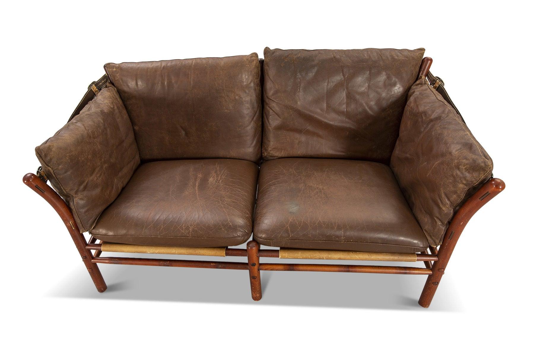 Origin: Sweden
Designer: Arne Norell
Manufacturer: Norell Møbler AB
Era: 1960s
Materials: Beech, leather
Measurements: 58.75? wide x 31.5? deep

Condition: In excellent original condition with some vintage wear to the cushions.