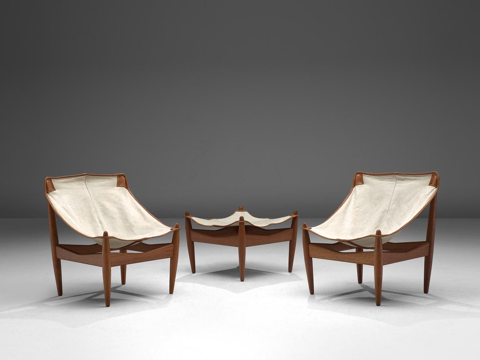 Illum Wikkelsø C.F. Christiansen, pair of easy chairs and ottoman model 272, teak, canvas and leather, Denmark, 1960s.

Very rare easy chairs and ottoman model 272 in teak and canvas designed by Illum Wikkelsø. The solid teak legs are tapered and