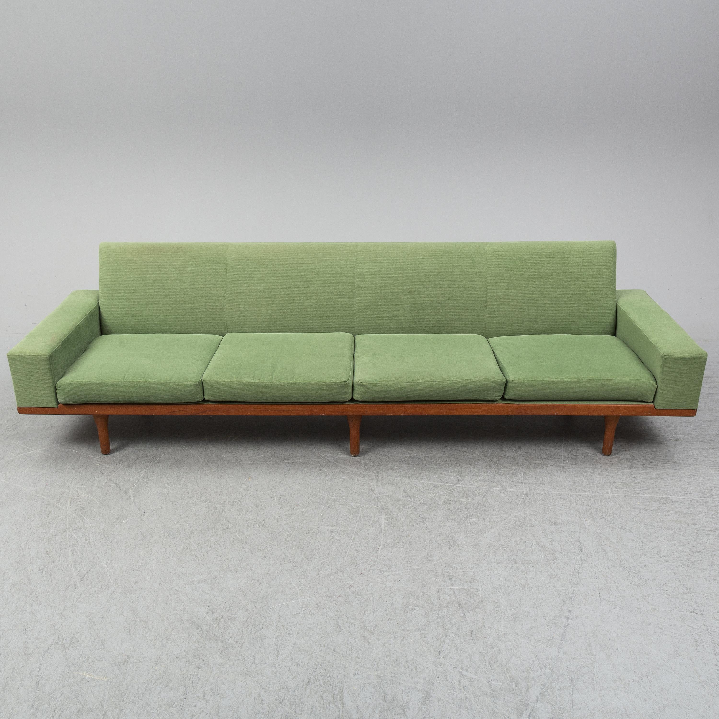 The low lines typical of Danish design make The Australia a perfect piece of furniture. A subtle internal spring back and firm cushions create a comfortable seating experience.  Much of Wikkelso's work was inspired by nature, perhaps the vast open