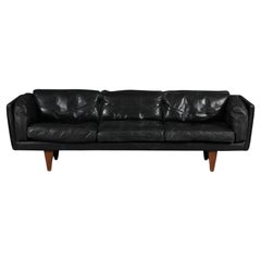 Illum Wikkelsø Black Leather and Rosewood Three-Seater Sofa