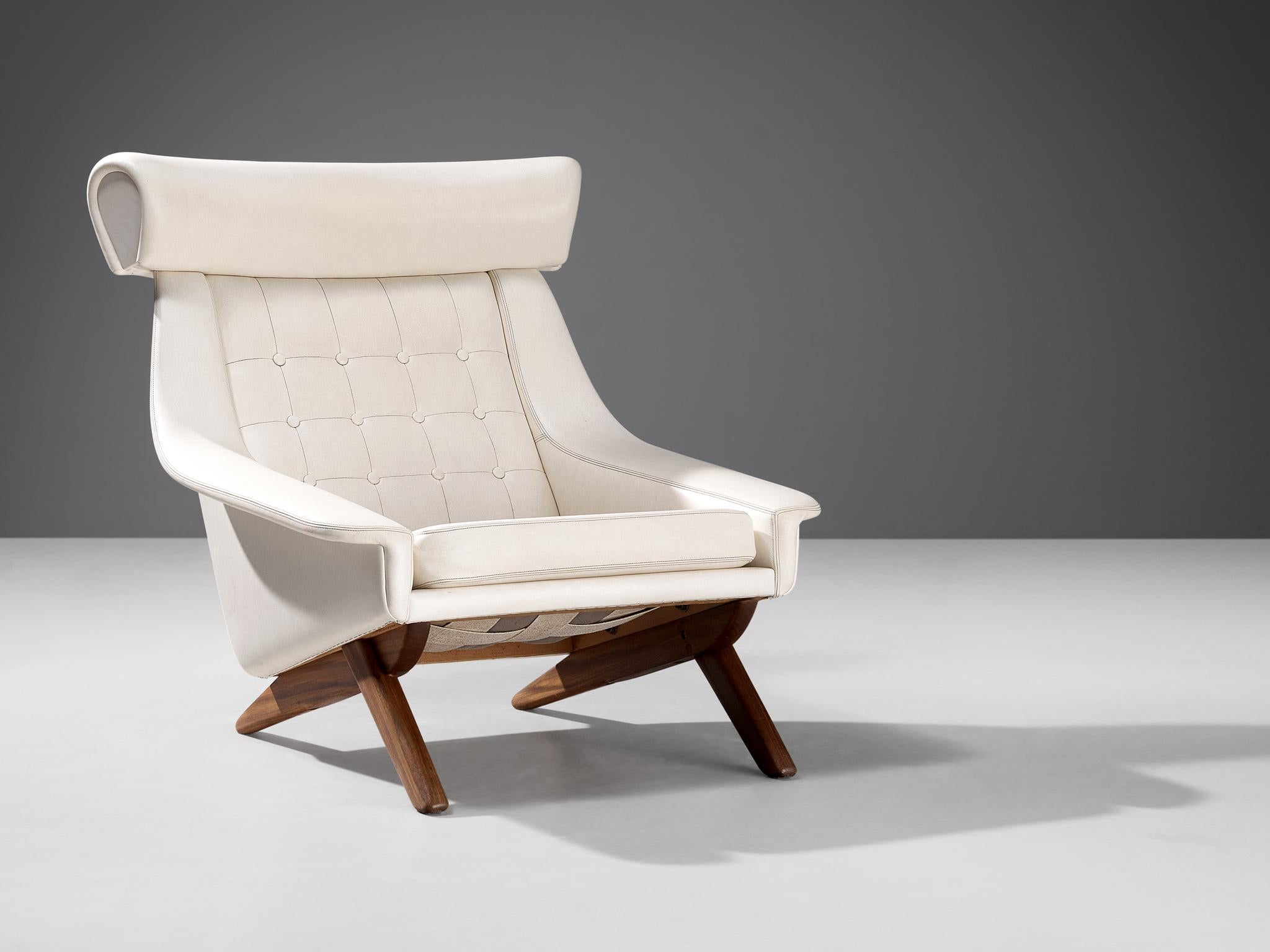 Illum Wikkelsø, lounge chair, leatherette, teak, Denmark 1960s.

Well-designed easy chair in pearlescent white leatherette upholstery  by Danish designer Illum Wikkelsø. This 'Ox Chair' shows some interesting details. For instance, the wide and