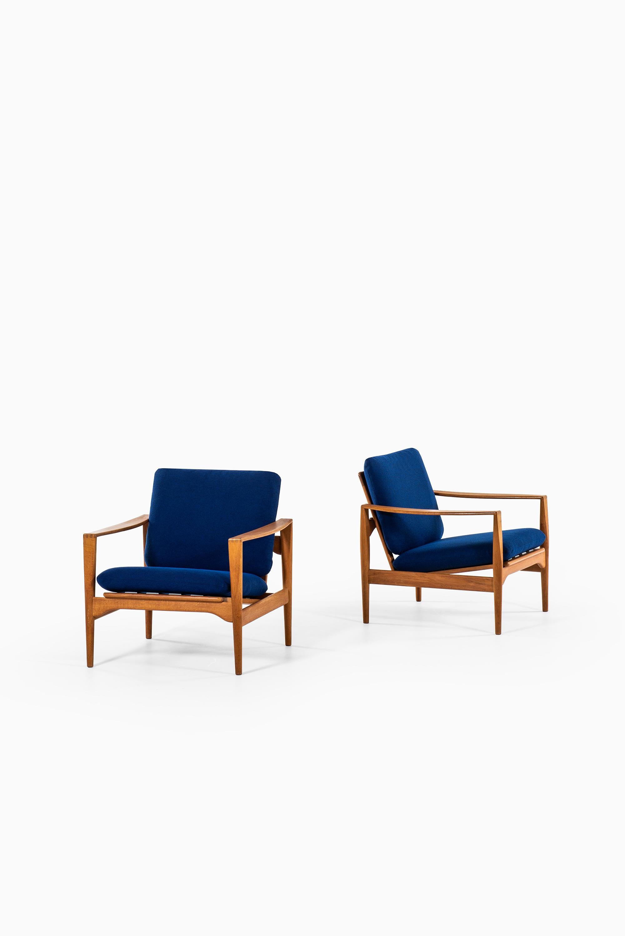 Rare pair of easy chairs model Ek designed by Illum Wikkelsø. Produced by Niels Eilersen in Denmark.