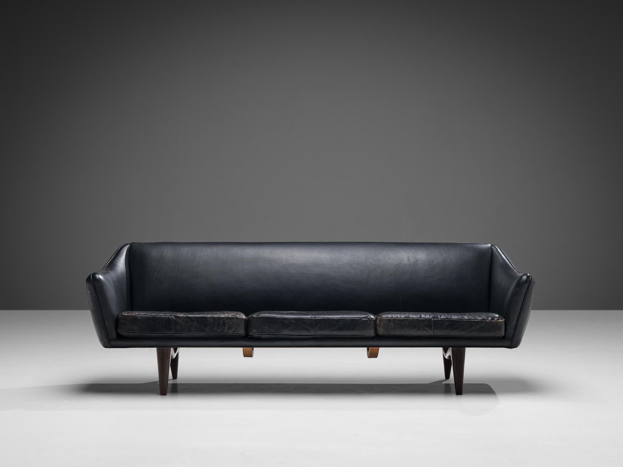 Illum Wikkelsø for A. Mikael Laursen & Søn, sofa, model 'ML-140', leather, mahogany, Denmark, 1950s. 

This sophisticated sofa shows an unusual elegance and great eye for detail, combined with outstanding craftsmanship, which is characteristic for