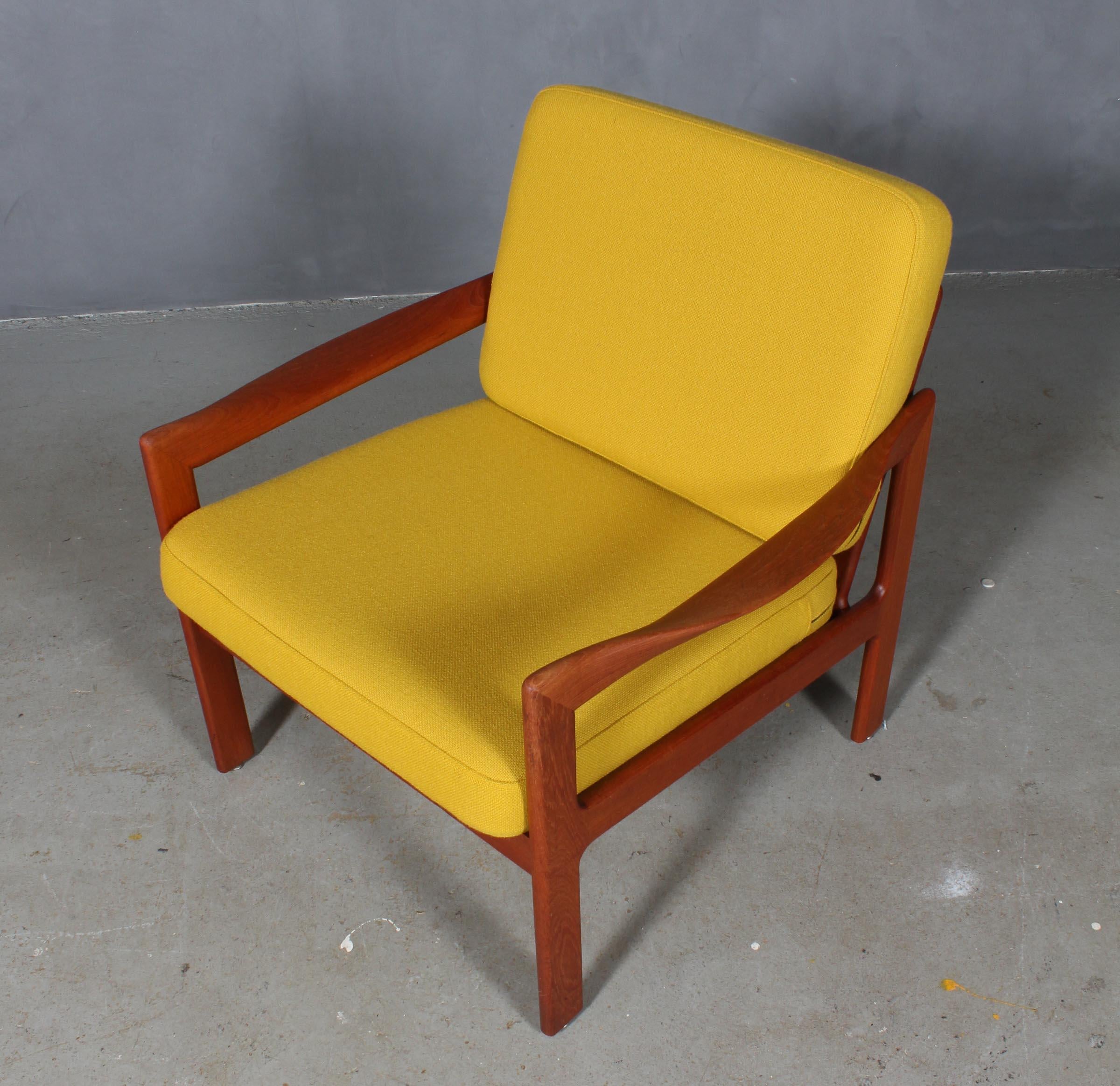 Illum Wikkelso for N. Eilersen lounge chair in solid teak with impressive armrest.

New upholstered with yellow Hallingdal wool from Kvadrat.

Model 20, made by N. Eilersen.

Impressive craftmanship with the most beautiful curved armrests.