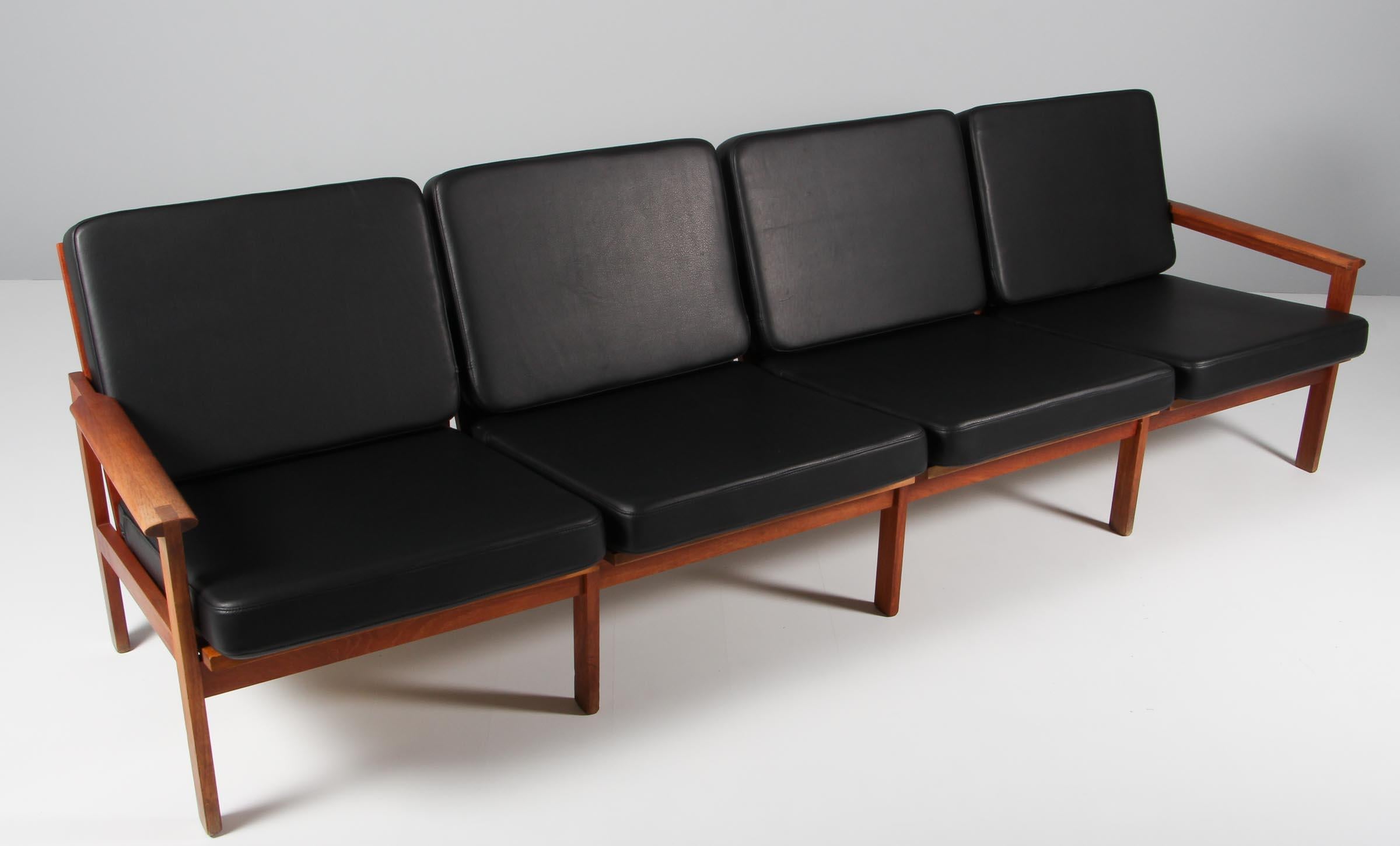 Illum Wikkelso for N. Eilersen four seat sofa in solid teak.

New upholstered with black aniline leather. 

Model Capella, made by N. Eilersen.
  