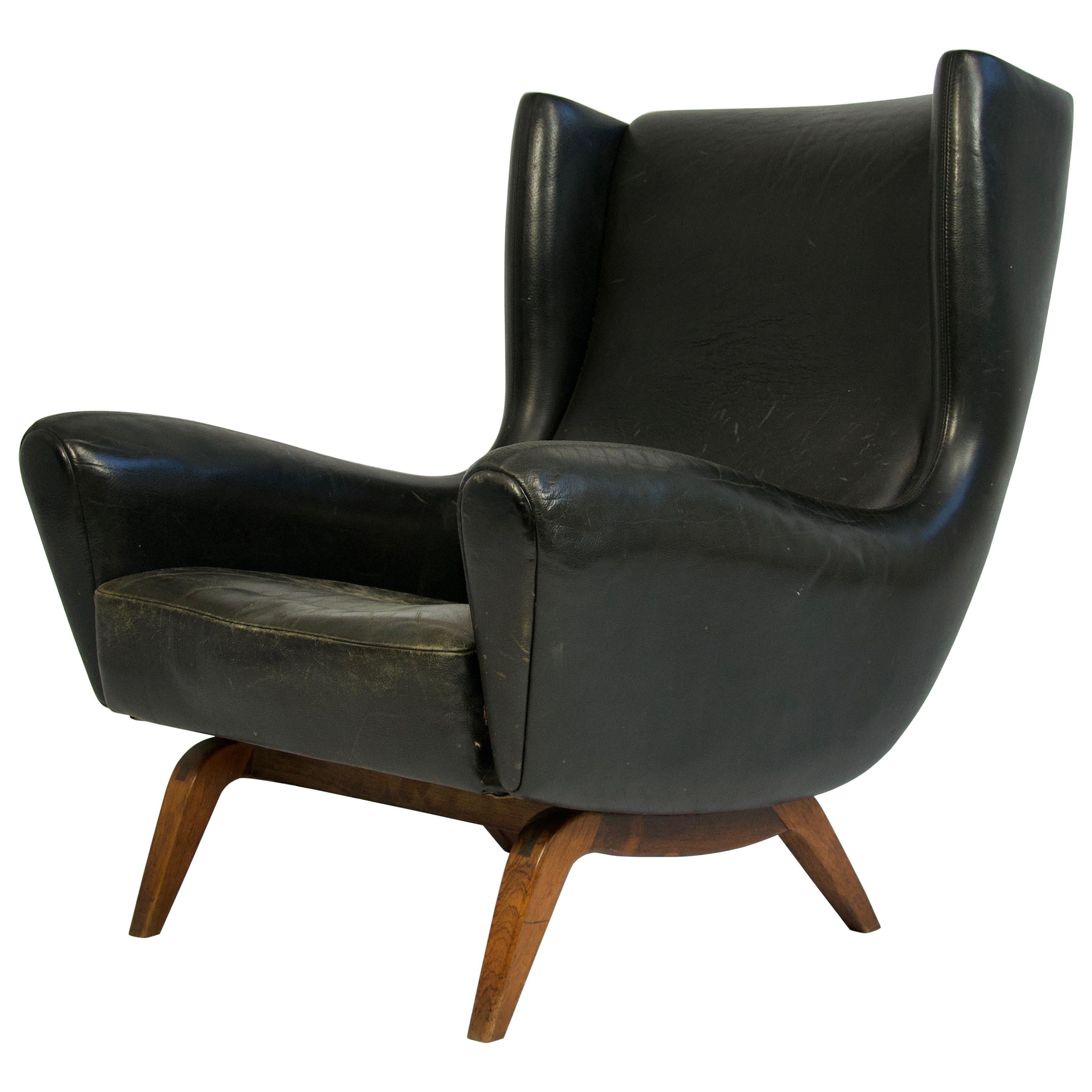 Illum Wikkelsø Leather and Rosewood Lounge Chair For Sale