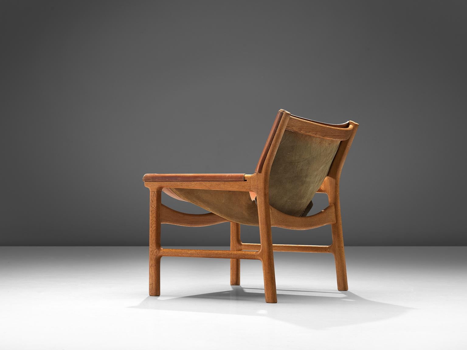 Scandinavian Modern Illum Wikkelsø Lounge Chair in Cognac Leather and Oak