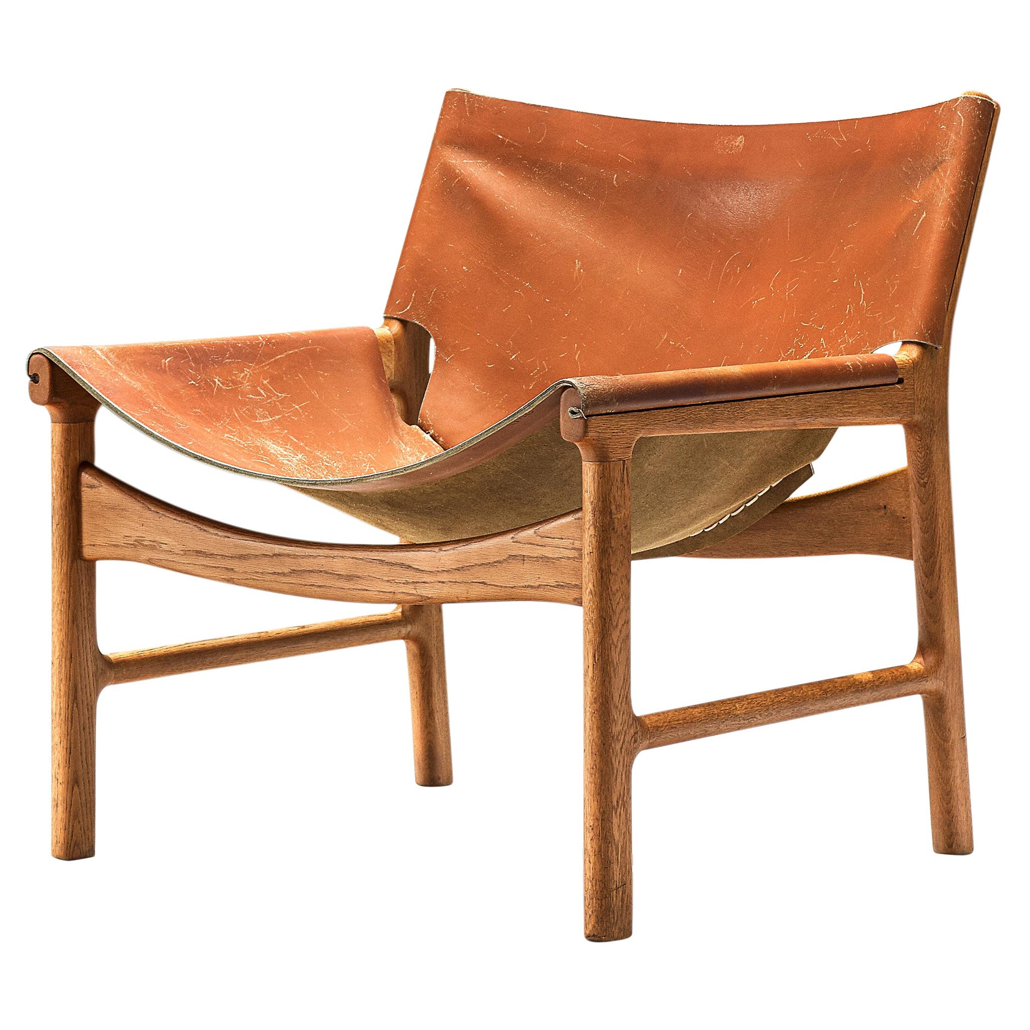 Illum Wikkelsø Lounge Chair in Cognac Leather and Oak