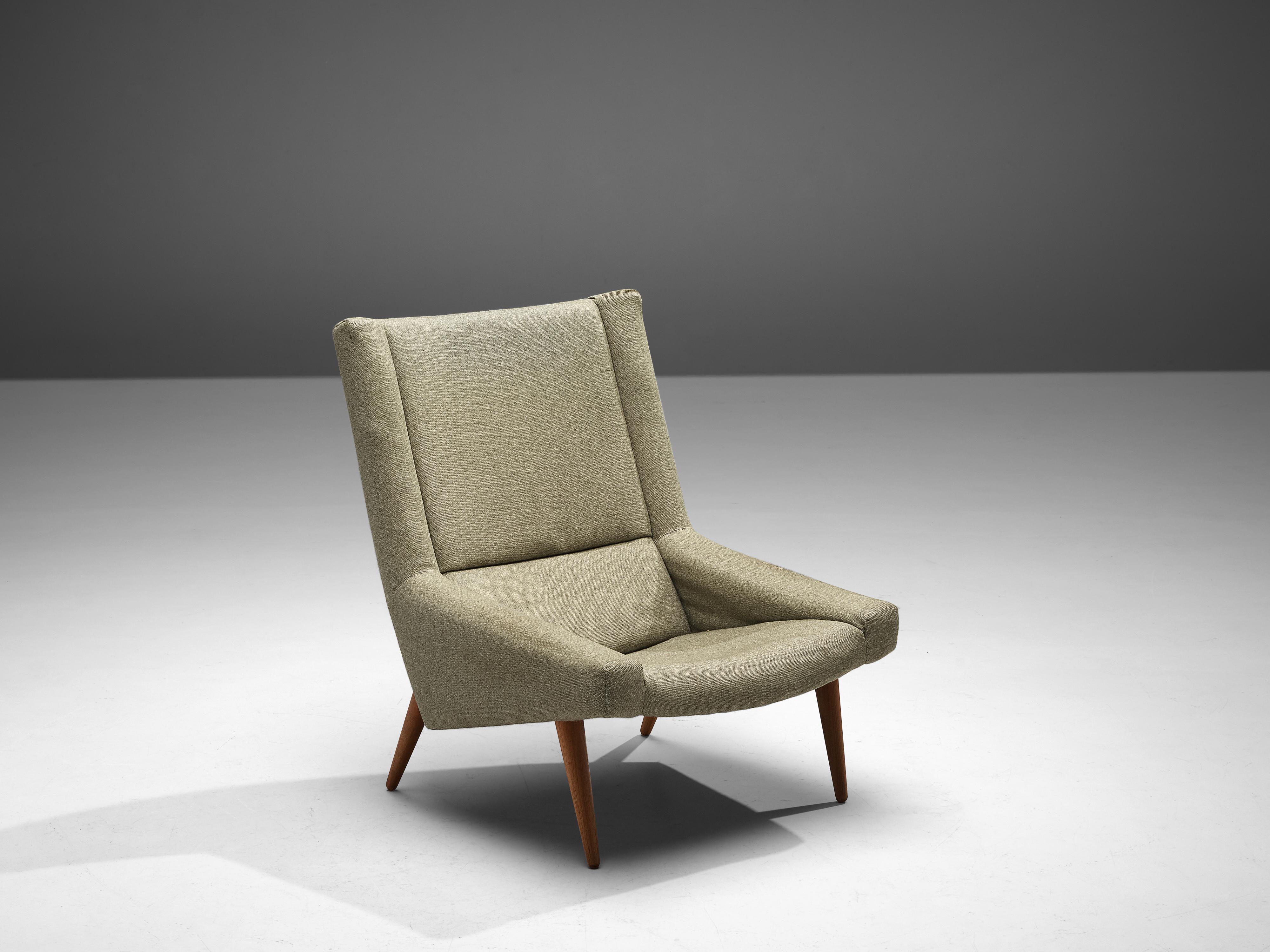 Illum Wikkelsø, lounge chair, fabric upholstery, teak Denmark, 1950s

Comfortable lounge chair by Danish designer Illum Wikkelsø. The shape of the chair is characterized by the high backrest that floats over into the low, pointy armrests. A