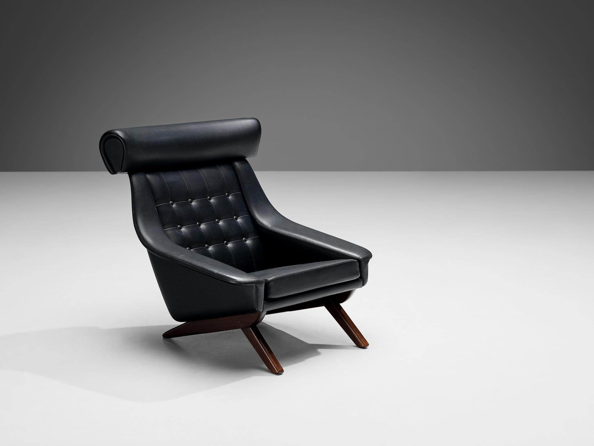 Illum Wikkelsø, 'Ox' lounge chair, black leatherette, teak, Denmark 1960s.

Well-designed easy chair in black leatherette upholstery by Danish designer Illum Wikkelsø. This 'Ox Chair' shows some interesting details. For instance, the wide and large