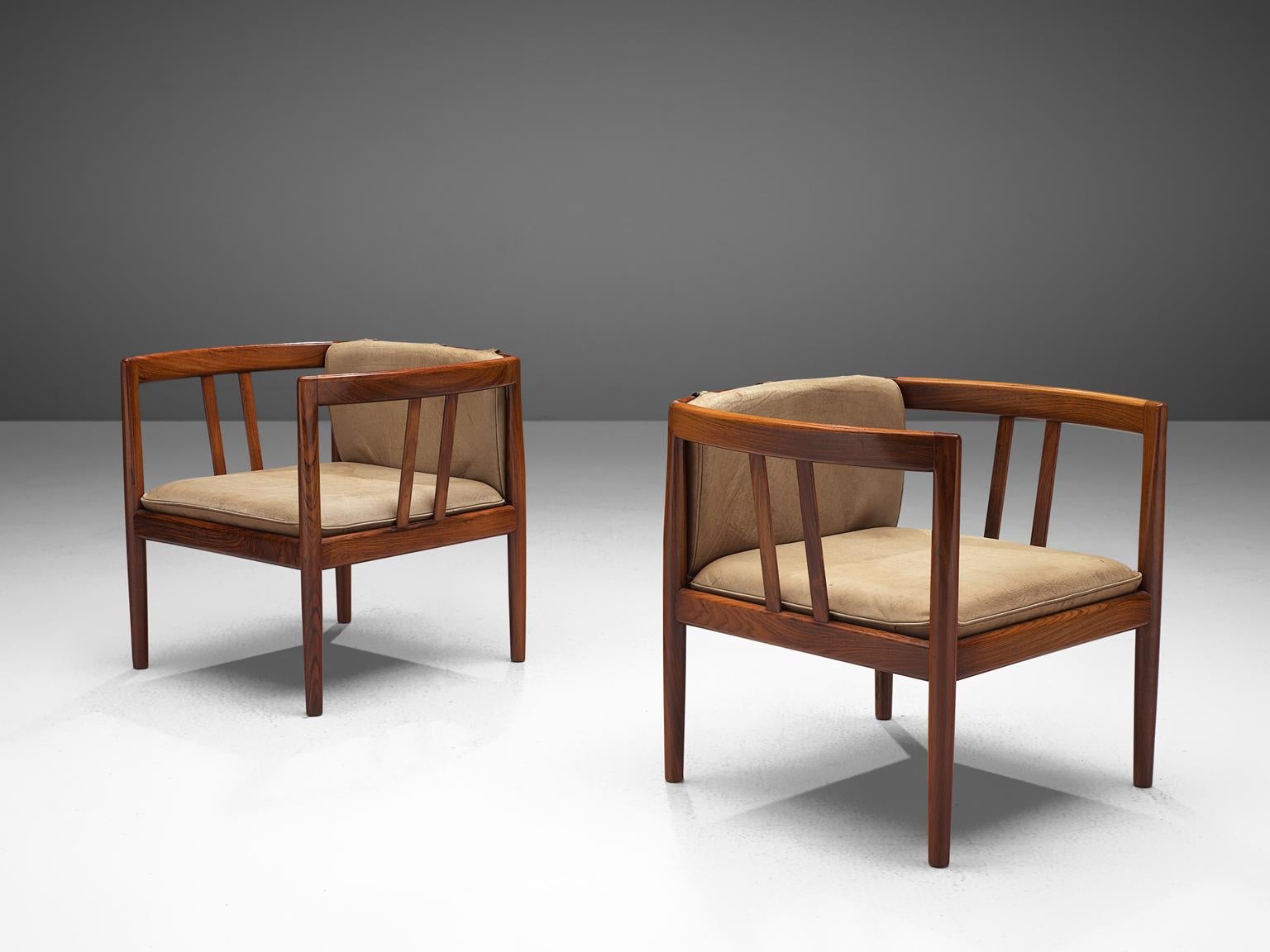 Set of two armchairs, in rosewood and beige to taupe leather by Illum Wikkelsø for Holger Christiansen, Denmark, circa 1964. 

A great looking pair of rosewood club chairs designed by Danish designer Illum Wikkelsø. These chairs, produced by