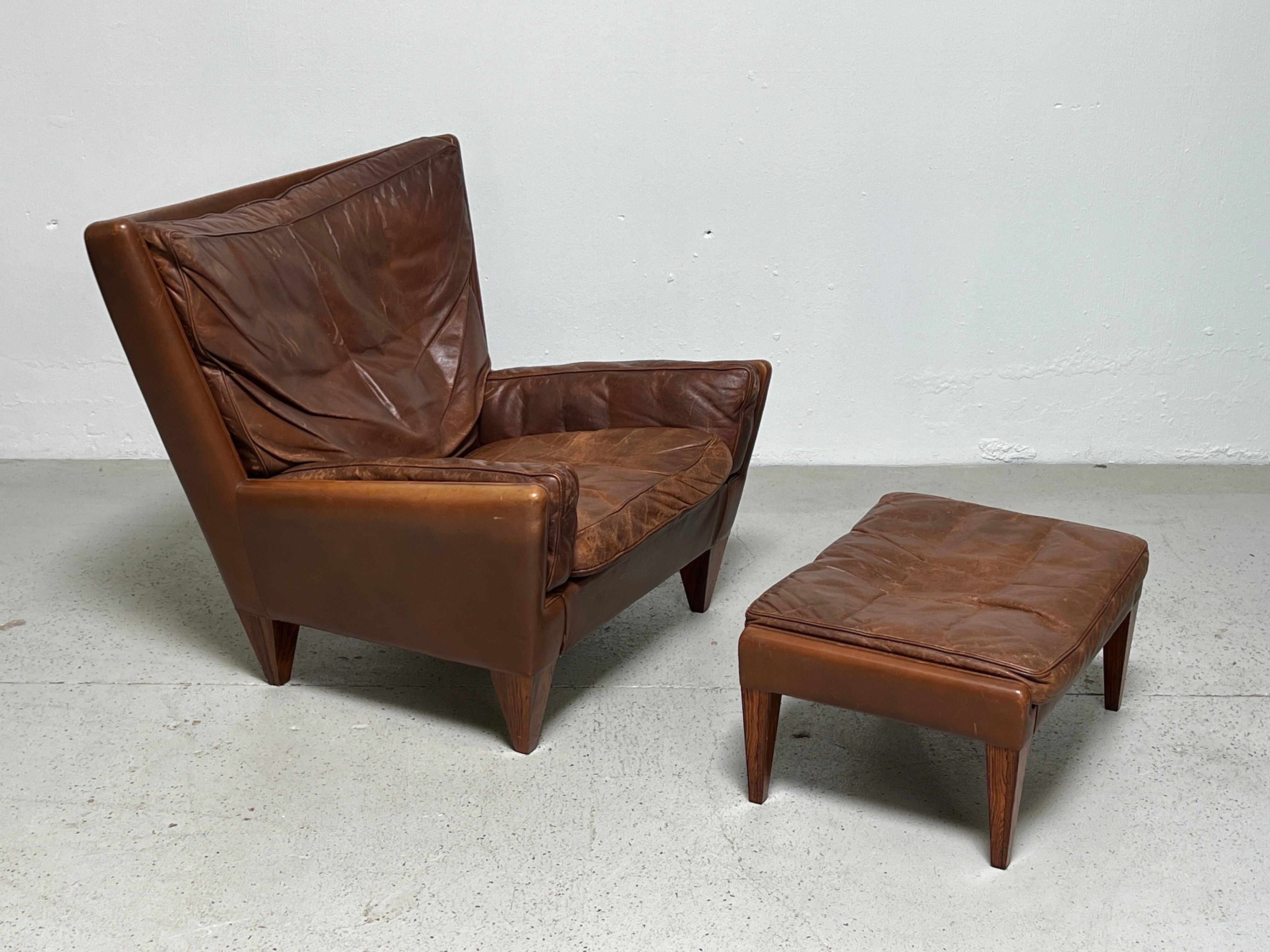 Illum Wikkelsø brown leather pyramid chair and ottoman for Holger Christiansen circa 1965. Beautiful patina to the original leather and rosewood.