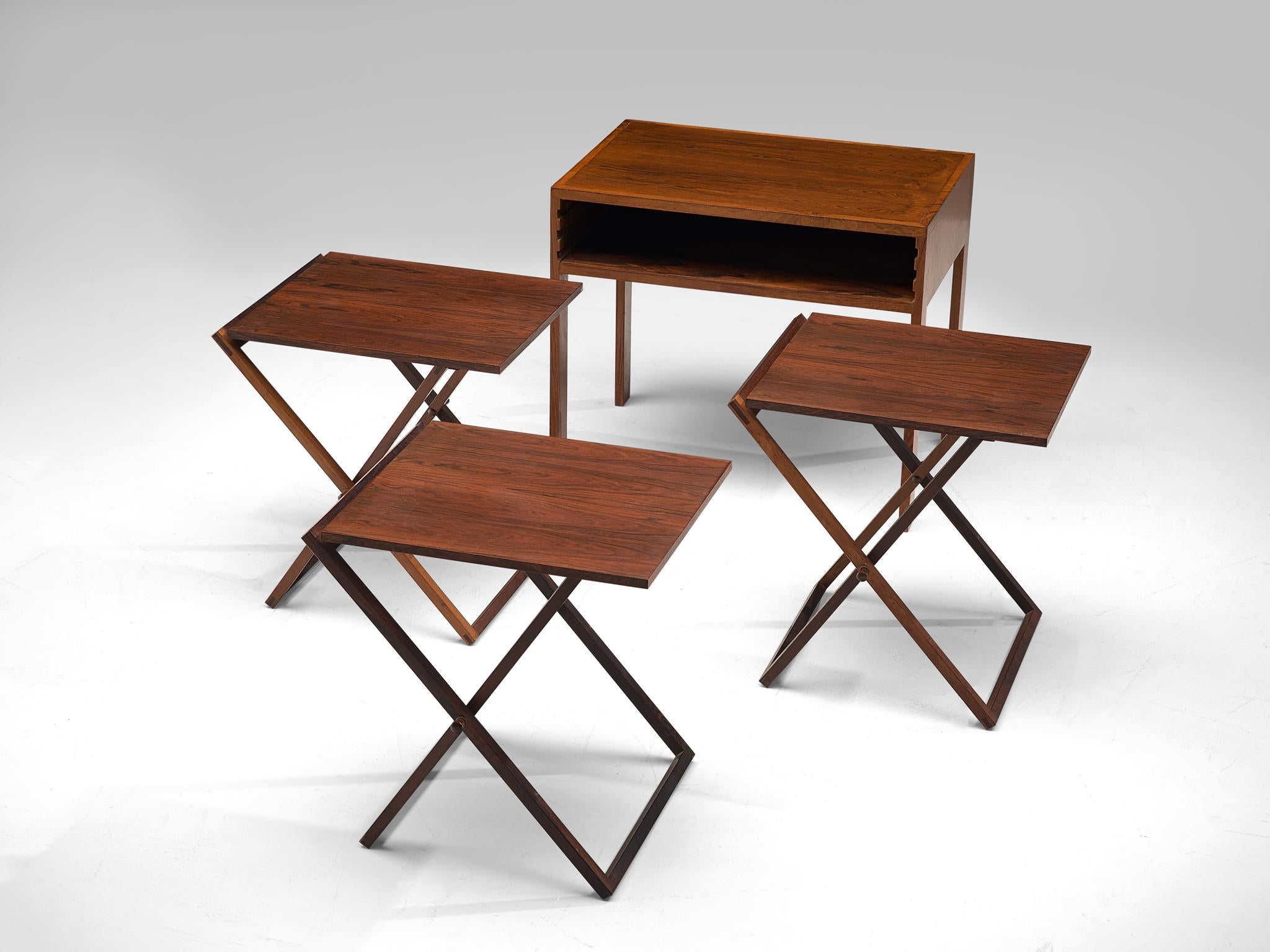 Illum Wikkelsø for Silkenborg, set of three side tables, rosewood and copper, 1950s, Denmark. 

This set, that is designed by Illum Wikkelsø was made by cabinet maker Silkenborg. The table is executed in rosewood with detailing such as the hinges