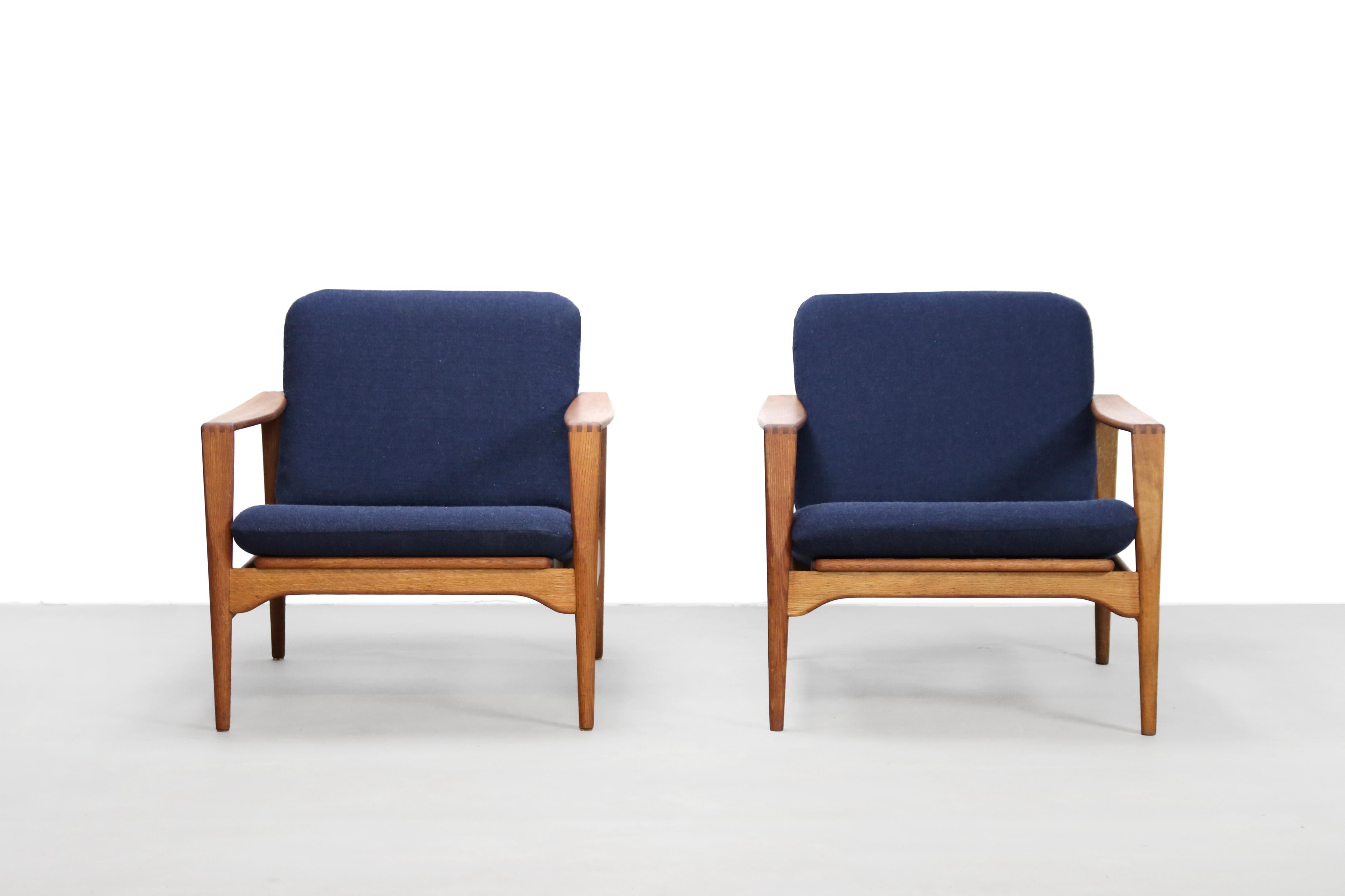Beautiful set of vintage armchairs in solid oak. The armchairs are designed by Danish designer Illum Wikkelsø and produced by Niels Eilersen, Denmark in the 1960's. The frame is made of solid oak and has very nice details such as the wood connection