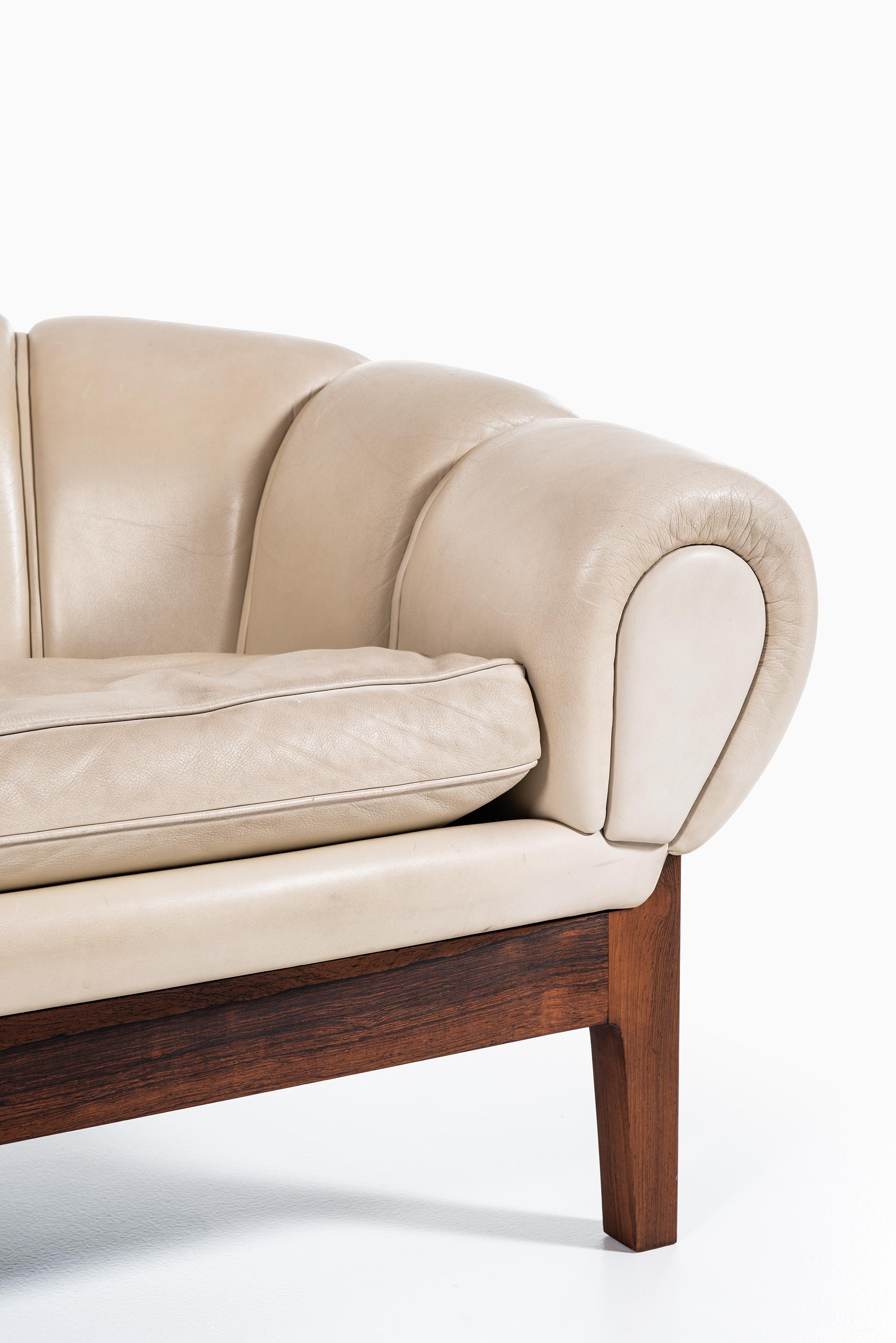 Very rare sofa model croissant designed by Illum Wikkelsø. Produced by Holger Christiansen in Denmark.