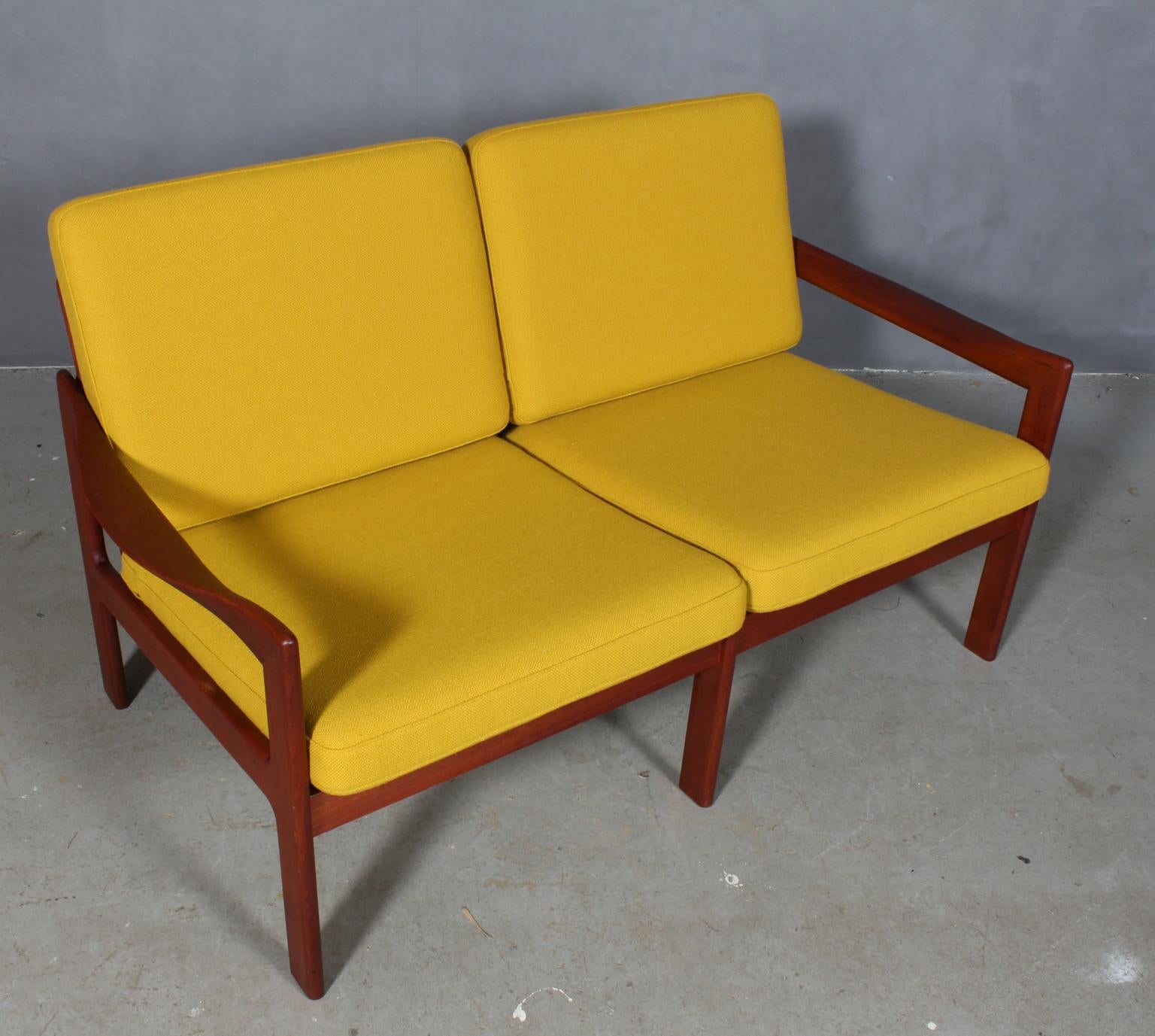 Illum Wikkelsæ two seat sofa with frame of teak. Sculptural armrests.

Cushions new upholstered with Halllingdal wool from Kvadrat.

Model 20, made by N. Eilersen.