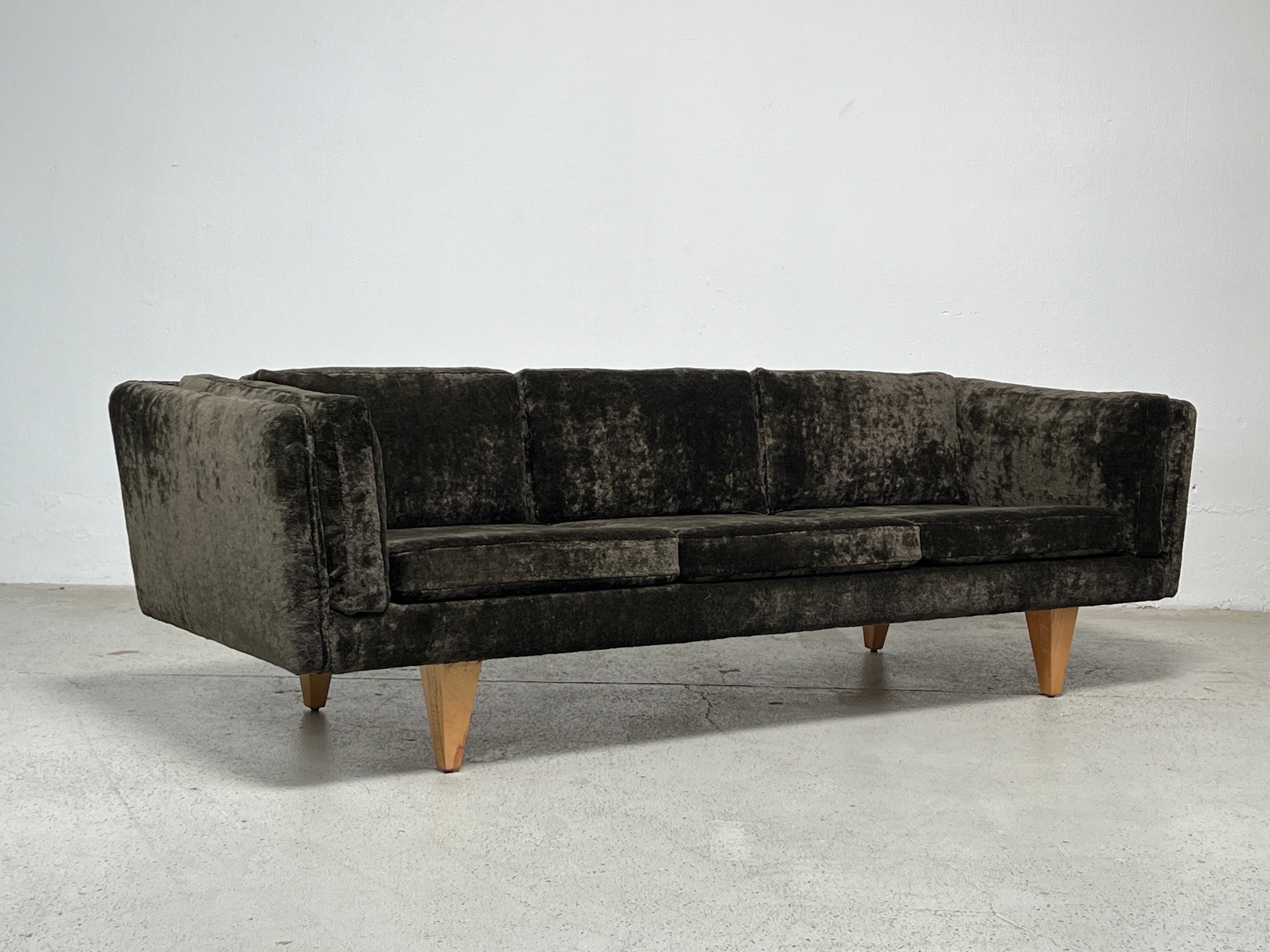 A beautifully restored V11 sofa designed by Illum Wikkelsø. The original birch legs have been refinished and the sofa has been reupholstered in Holly Hunt / Lush / Dusk thick velvet. The back cushions are down filled for a very comfortable sit. 