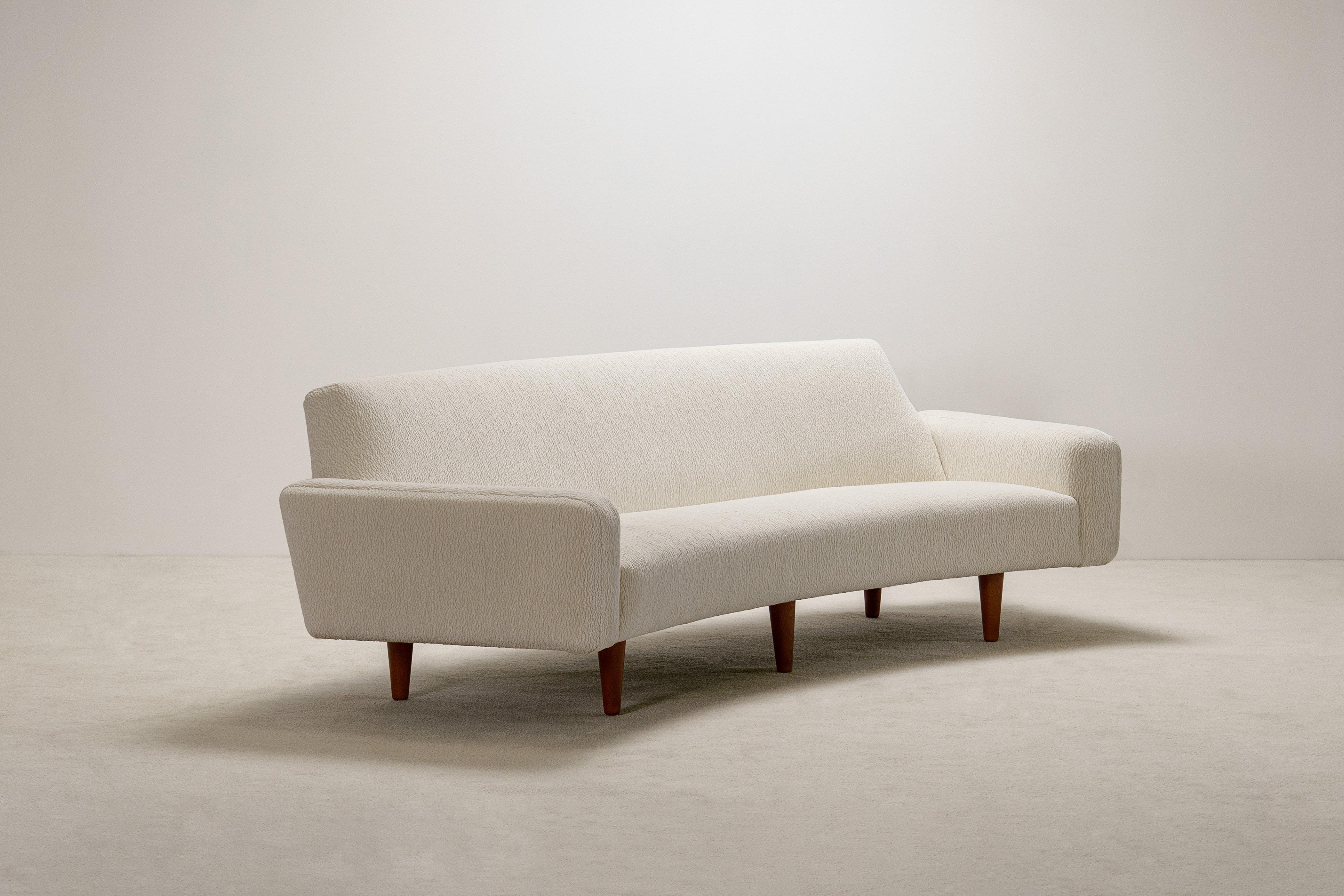 Scandinavian Modern Illum Wikkelso 3 Seat Curved Sofa Model 450. Circa 1960. New upholstery. For Sale