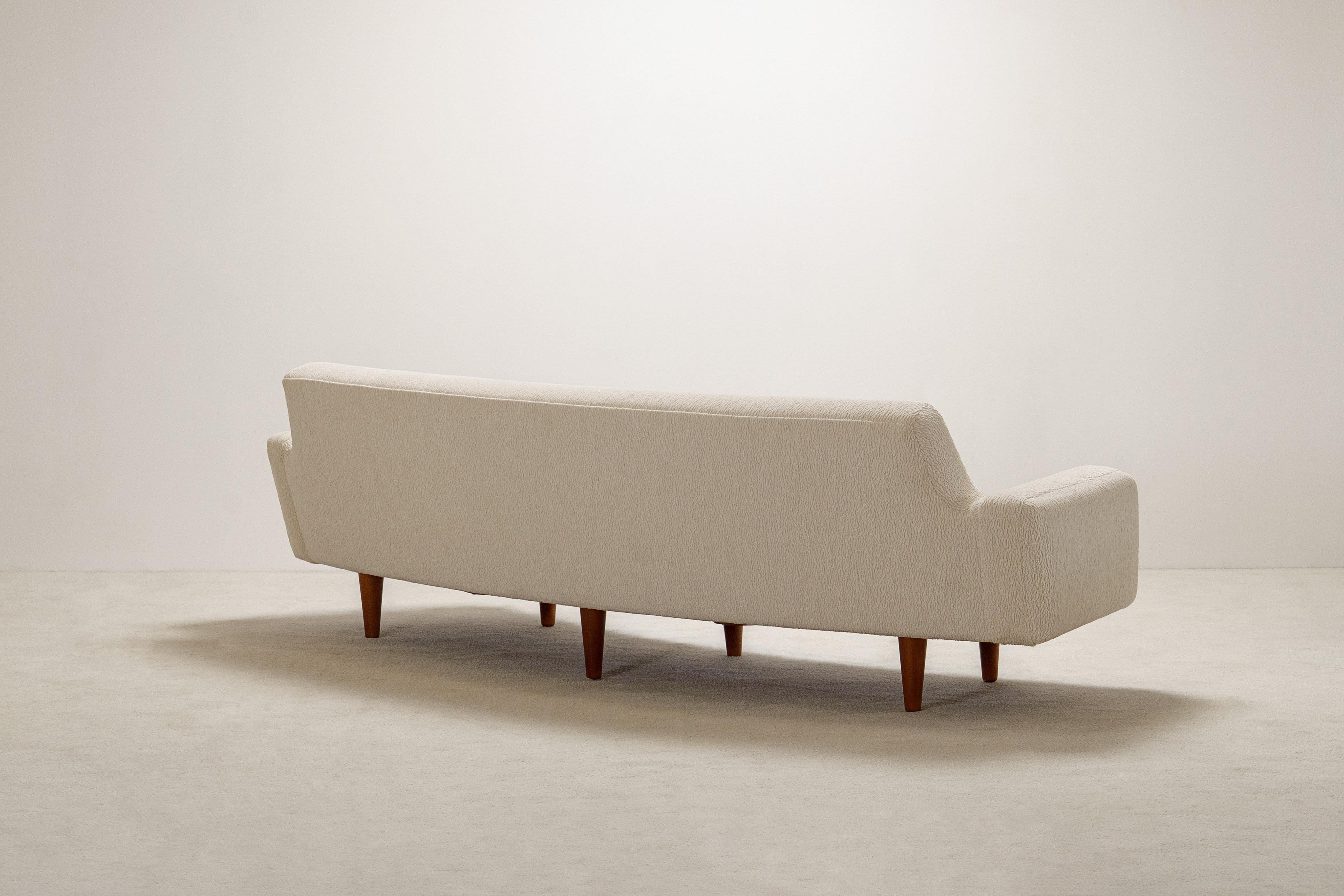 Mid-20th Century Illum Wikkelso 3 Seat Curved Sofa Model 450. Circa 1960. New upholstery. For Sale