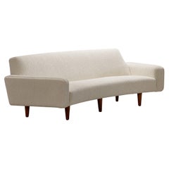 Illum Wikkelso 3 Seat Curved Sofa Model 450. Circa 1960. New upholstery.