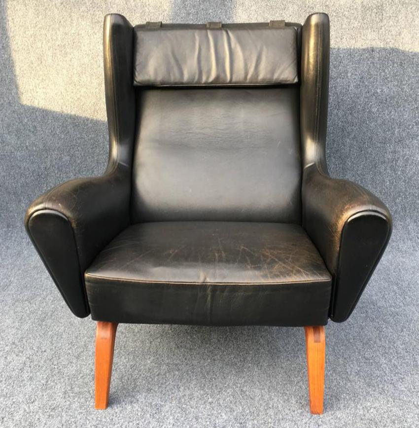 A very nice, completely original example, original leather and still with a rare removable headrest, held in place with sewn in lead counterweights.