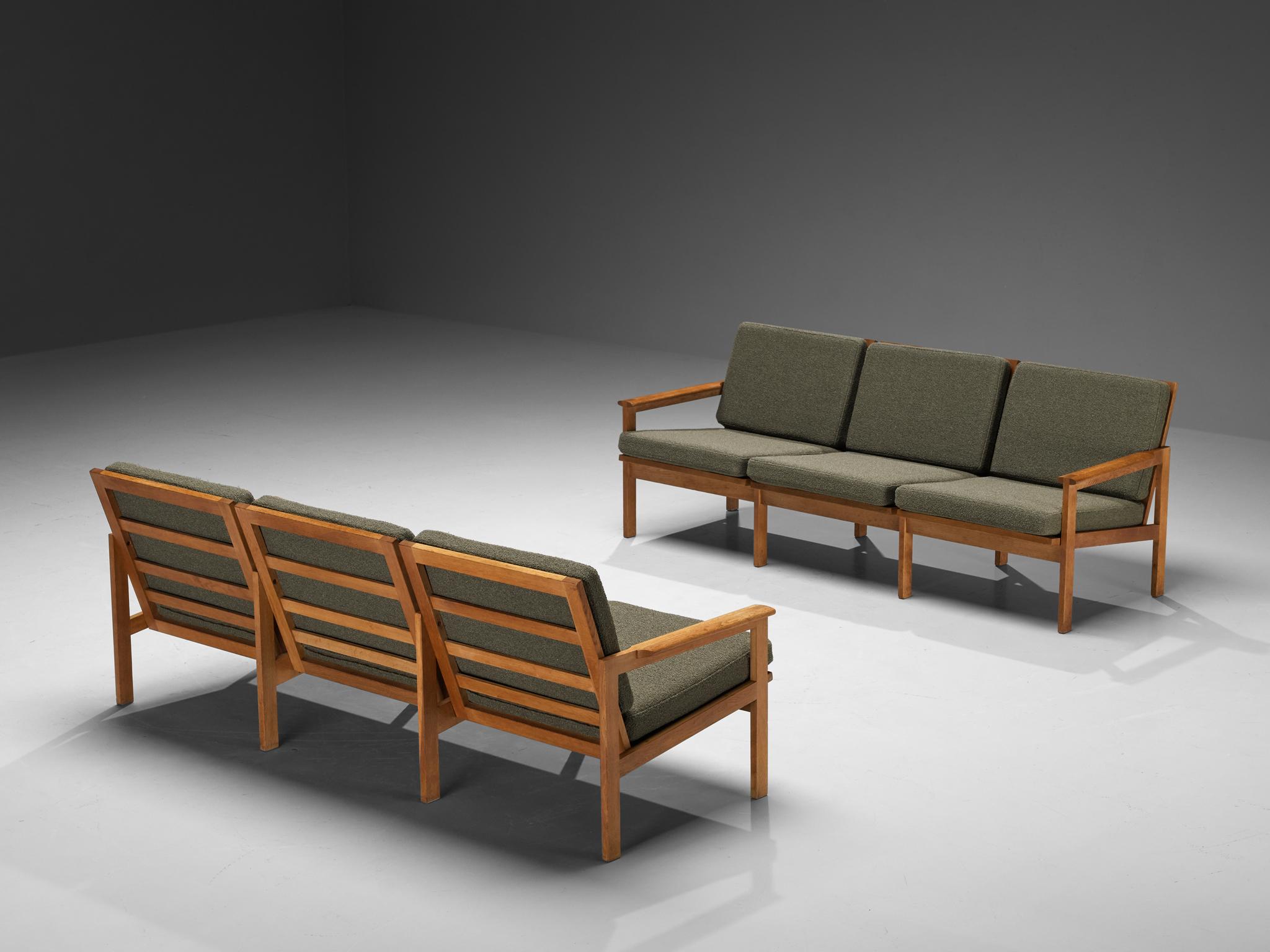 Illum Wikkelso for Niels Eilersen, 'Capella' three seat sofas, oak, fabric, Denmark, 1950s

Timeless and elegant Illum Wikkelsø 'Capella' three-seat sofas. Crafted in the 1950s, this exquisite piece exemplifies the sophisticated simplicity and