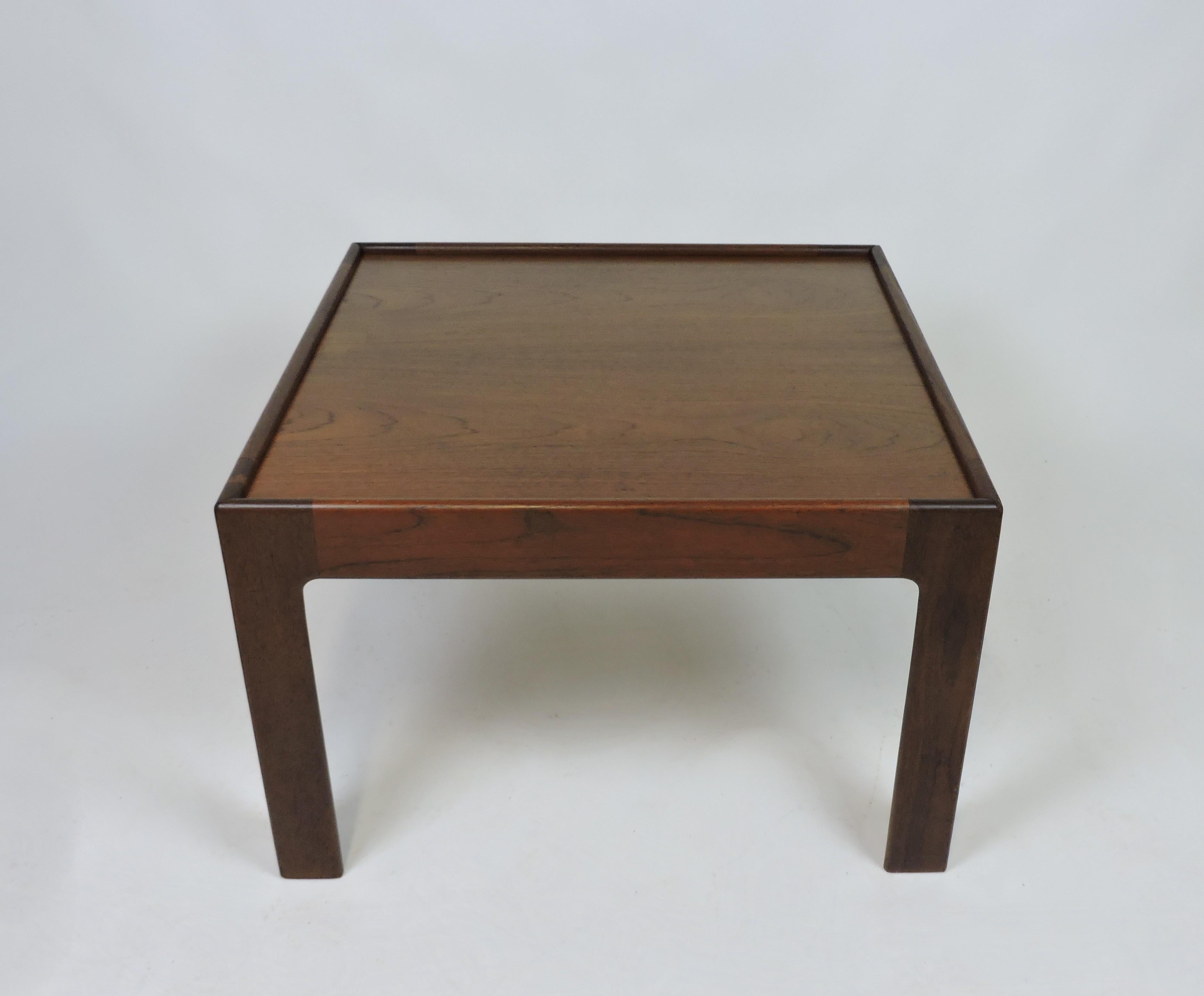 Handsome and substantial large end table designed by Illum Wikkelso and manufactured in Denmark by Neils Eilersen. This very well made table has solid teak legs and a top with beautiful wood grain. Labeled underneath.
It could also be used as a