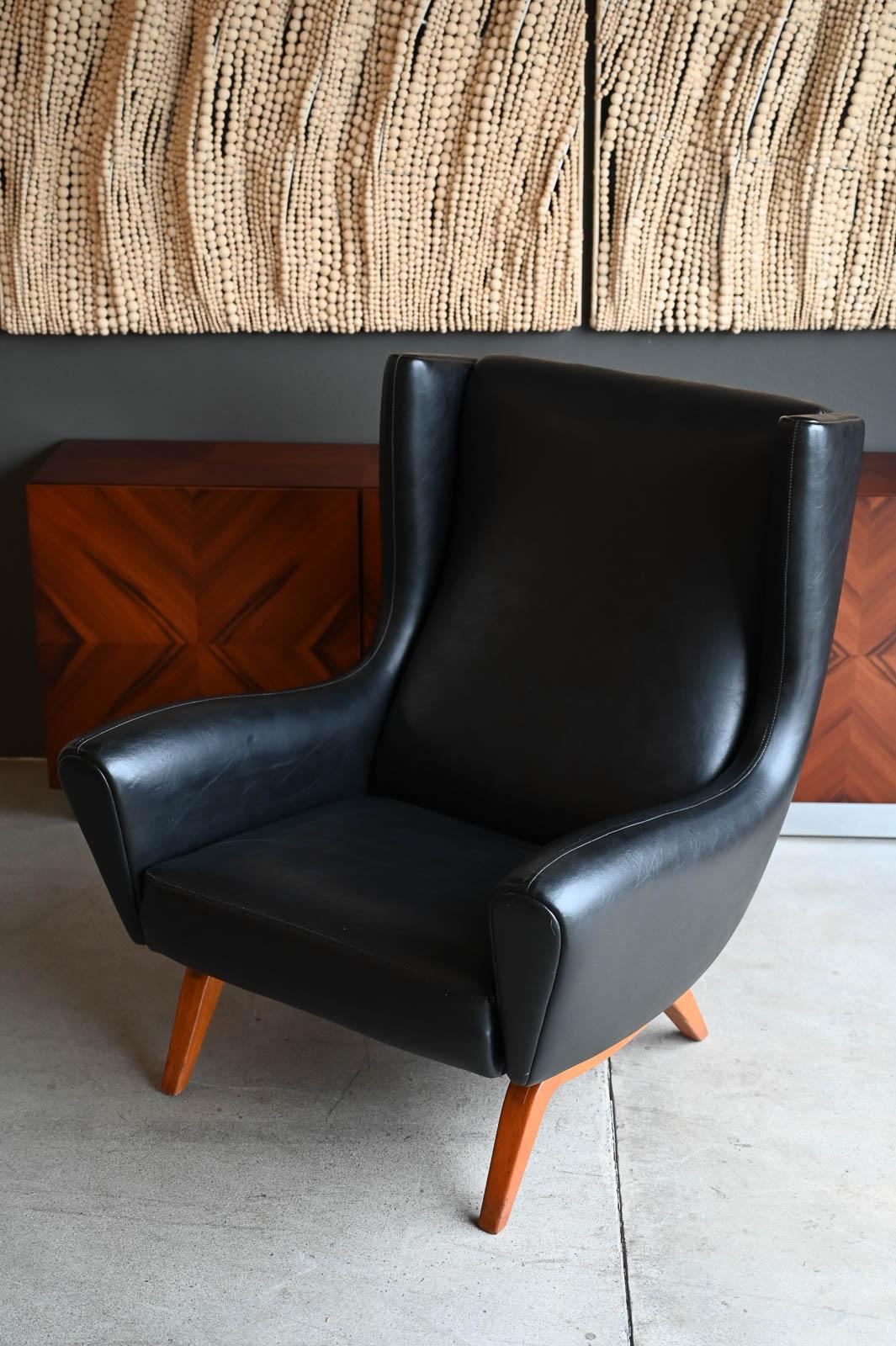 Illum Wikkelso for Soren Willadsen Model 110 Wingback Lounge Chair, ca. 1955.  Exceptional vintage ALL ORGINAL condition, this piece is museum worthy and in wonderful vintage condition with original black leather.  Very comfortable, able to seat a