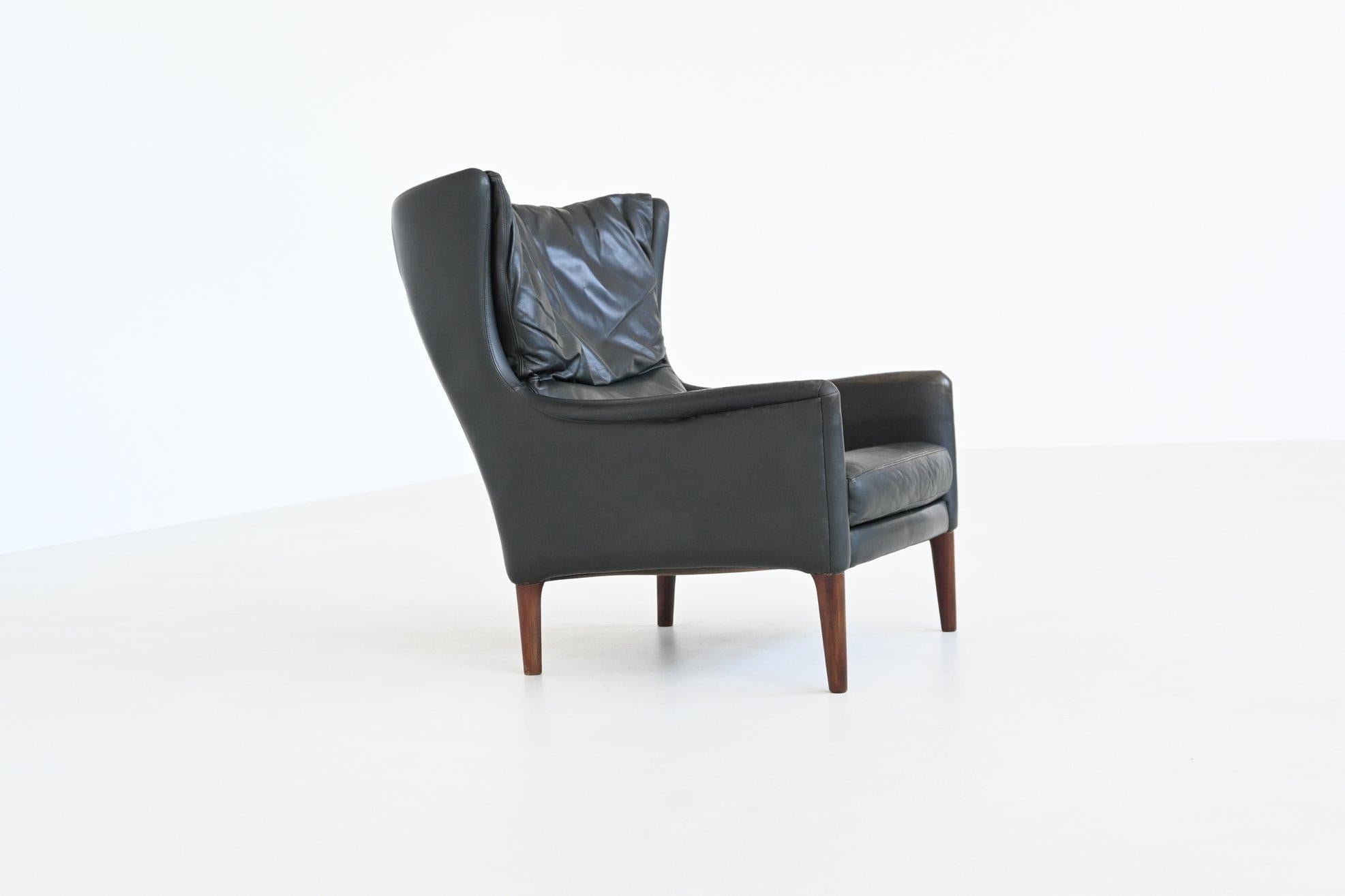 Illum Wikkelso lounge chair and foot stool in leather Denmark 1960 For Sale 5