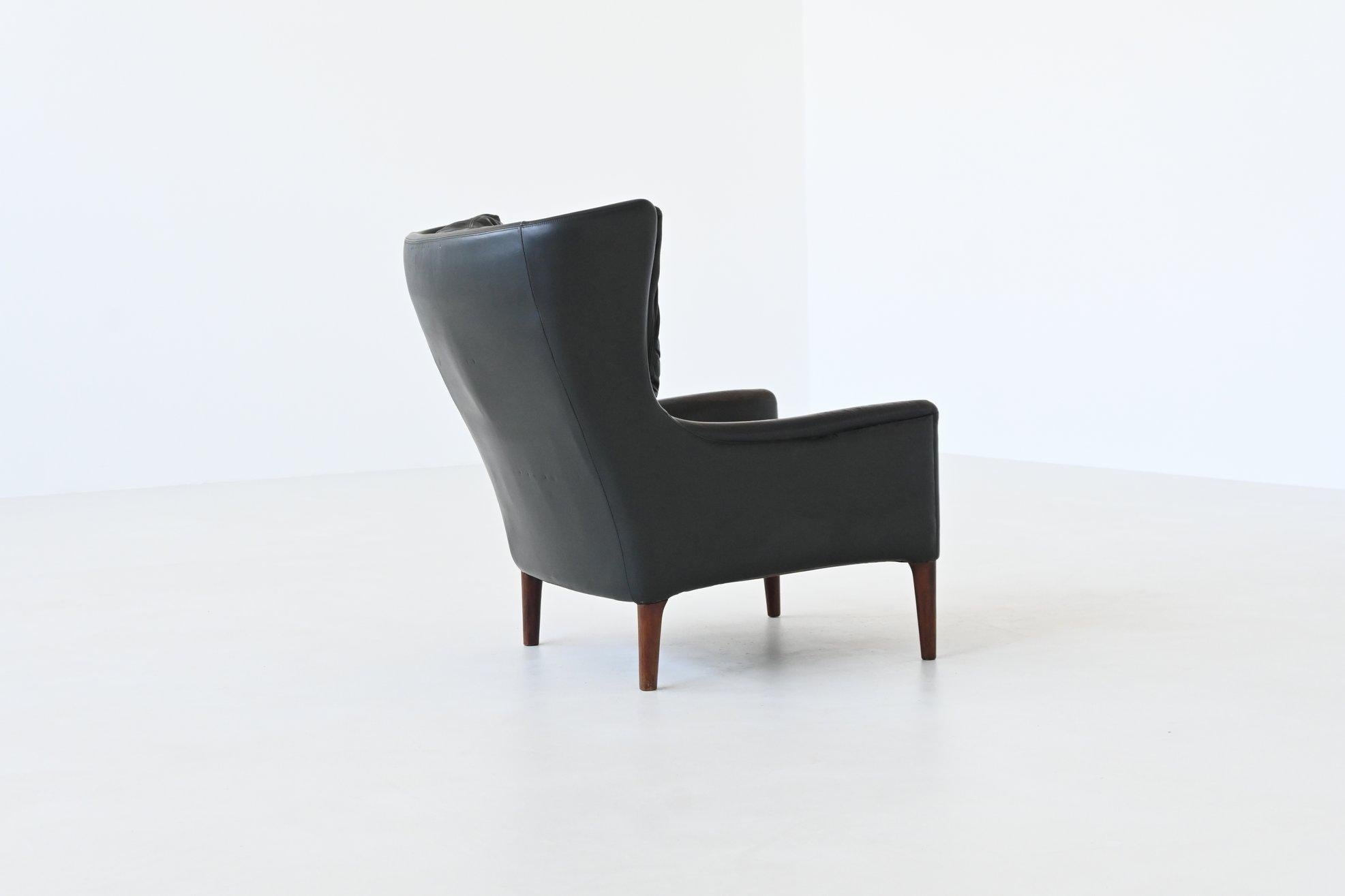 Illum Wikkelso lounge chair and foot stool in leather Denmark 1960 For Sale 6