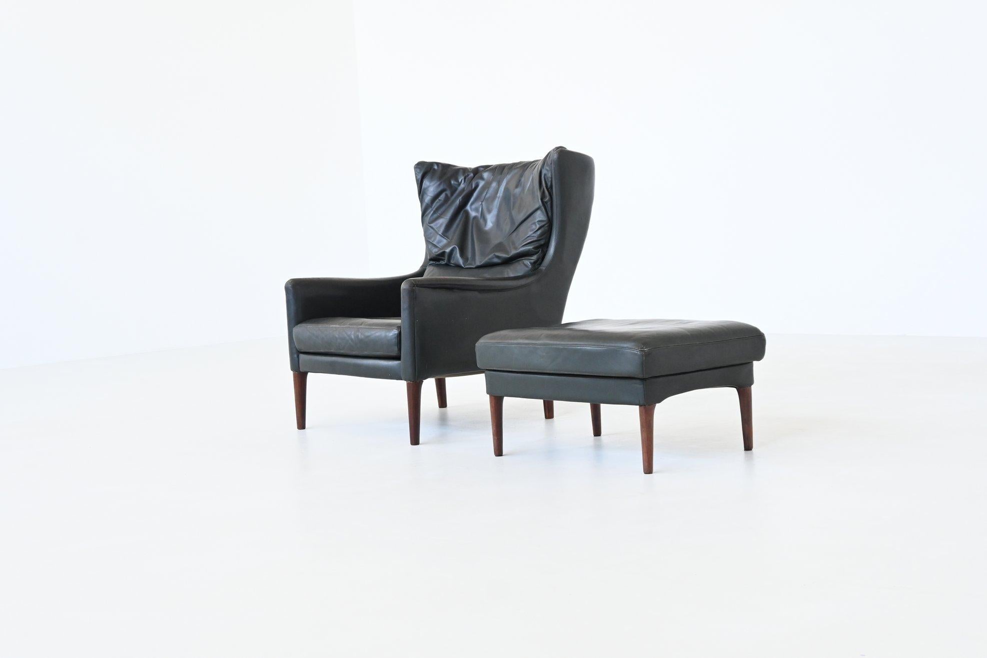Scandinavian Modern Illum Wikkelso lounge chair and foot stool in leather Denmark 1960 For Sale