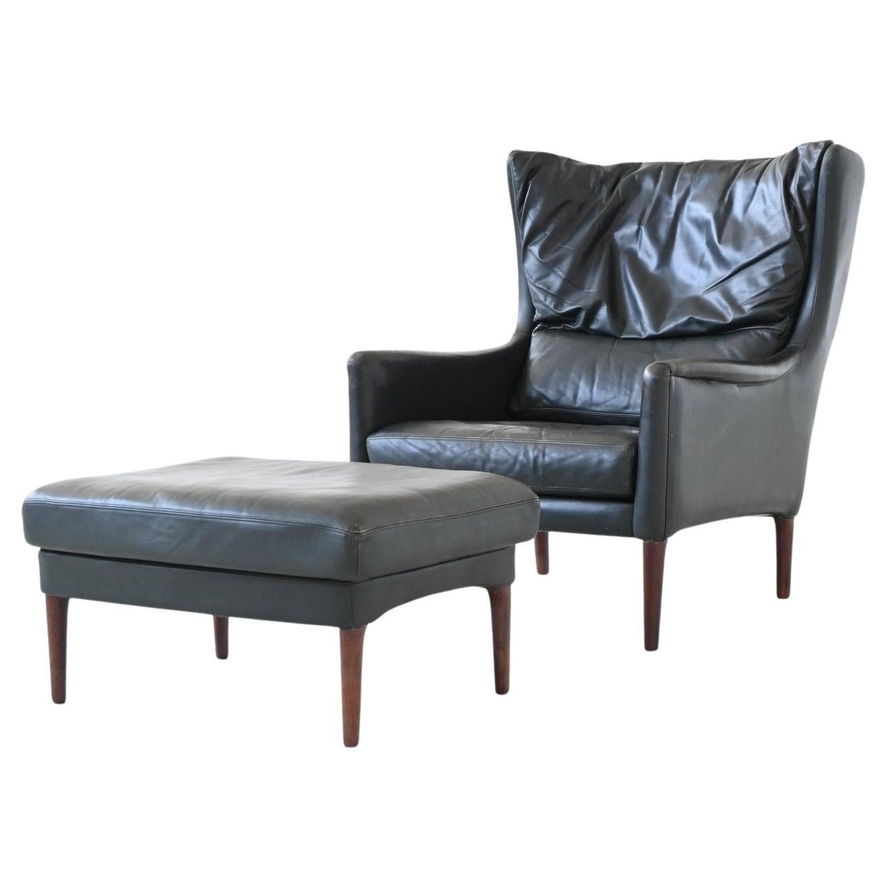 Illum Wikkelso lounge chair and foot stool in leather Denmark 1960