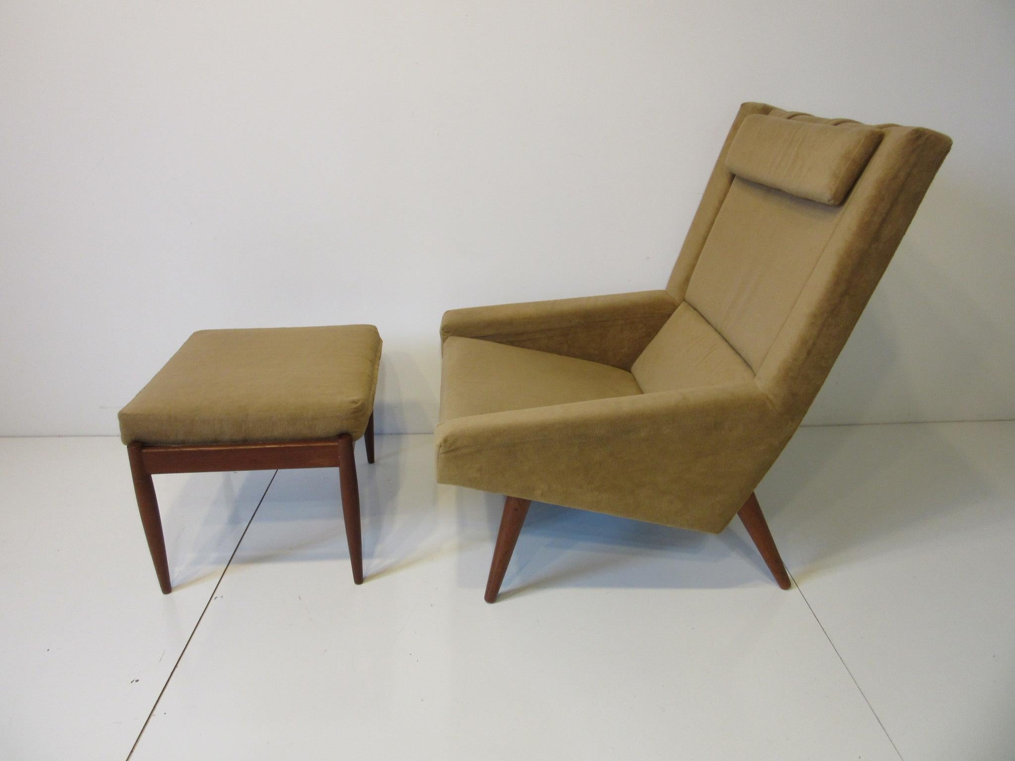 A soft and comfortable taupe colored lounge chair and ottoman with darker solid conical teak legs and matching headrest. Ergonomically designed and having the best of the great handcrafted work of the early Danish Modernists. This piece was lovingly