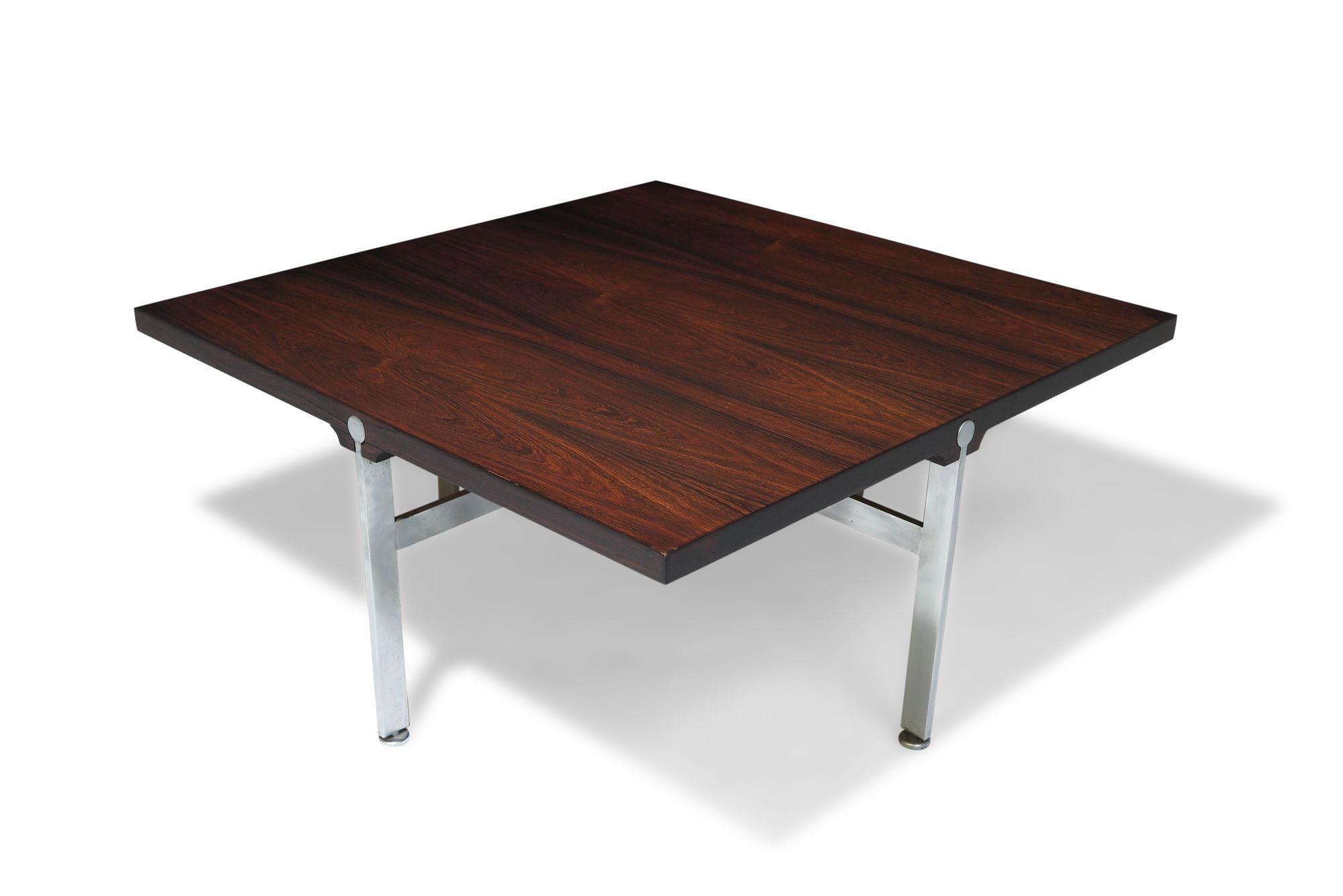 Square Rosewood coffee table designed by Illum Wikkelso for Soren Willadsen Mobelfabrik, 1960, Denmark. The coffee table is crafted of Brazilian rosewood and raised on steel legs. 
Measurements W 29.50'' x D 29.50'' x H 13.75''.