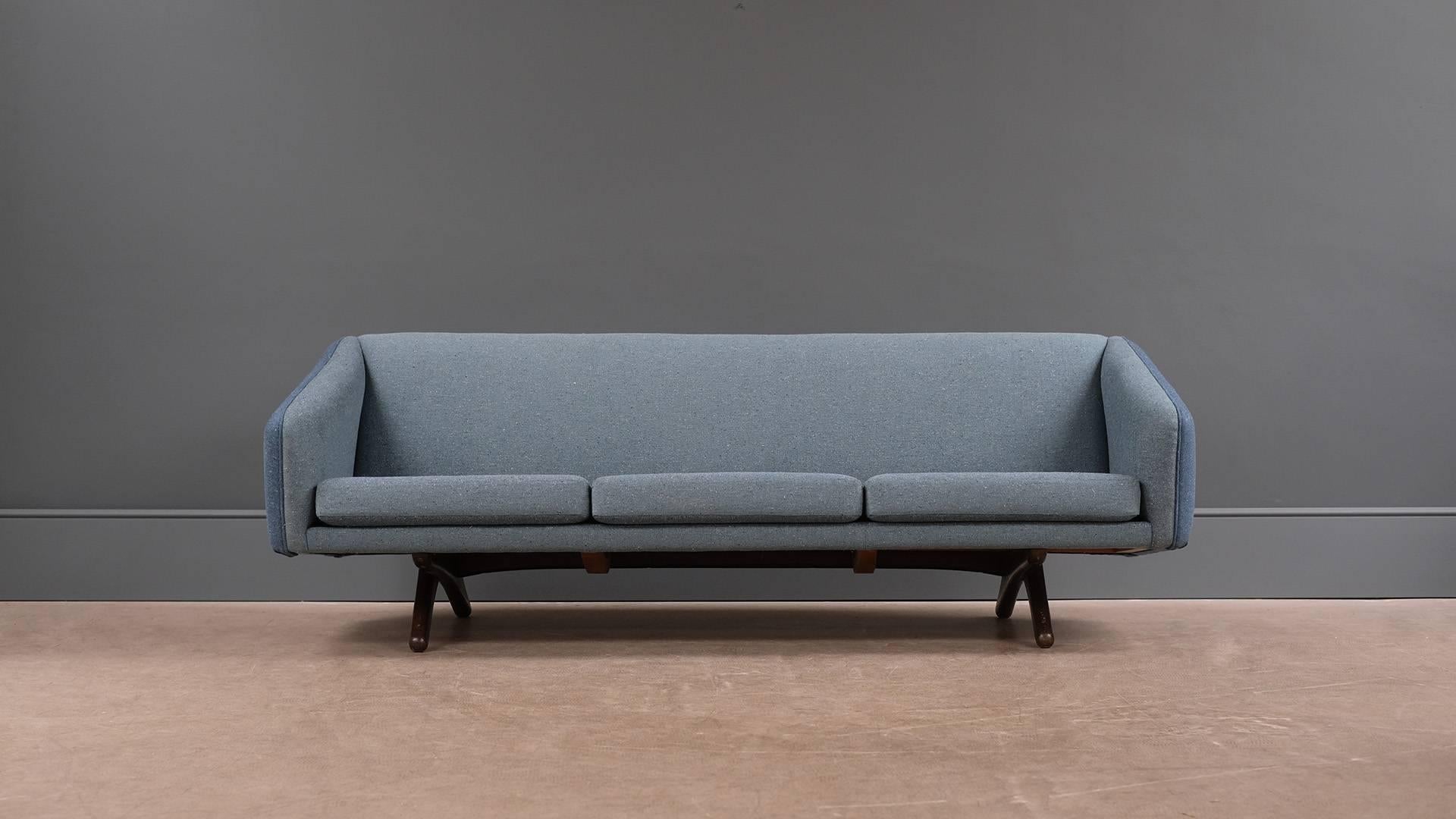 Rare and wonderful sofa designed by Illum Wikkelso for Mikael Laursen and Son, Denmark 1960. One of the best Danish sofas of the period with fantastic dark oak legs, this example fully reconditioned and reupholstered in fabulous two tone fabric.