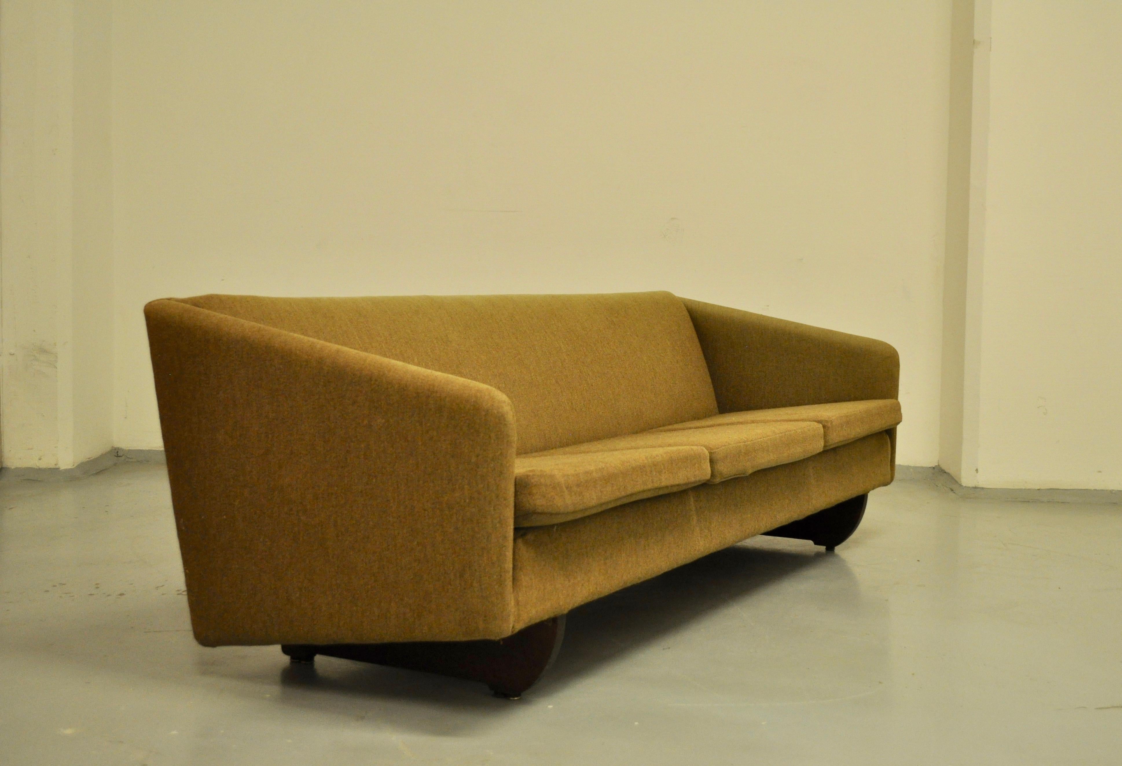 Danish sofa designed by Illum Wikkelso wearing its original fabric. Its beech base responds to a customer's special order and makes it even more rare.