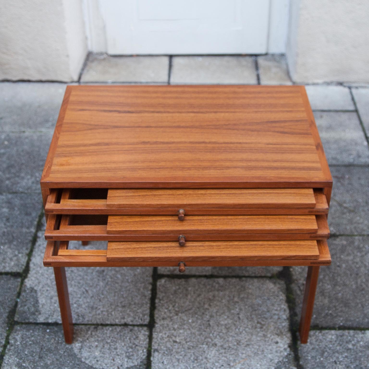 Rare Illum Wikkelso set of three folding tables that nest into an occasional
table for storage. Manufactured for Silkeborg Furniture Makers Denmark
1960.