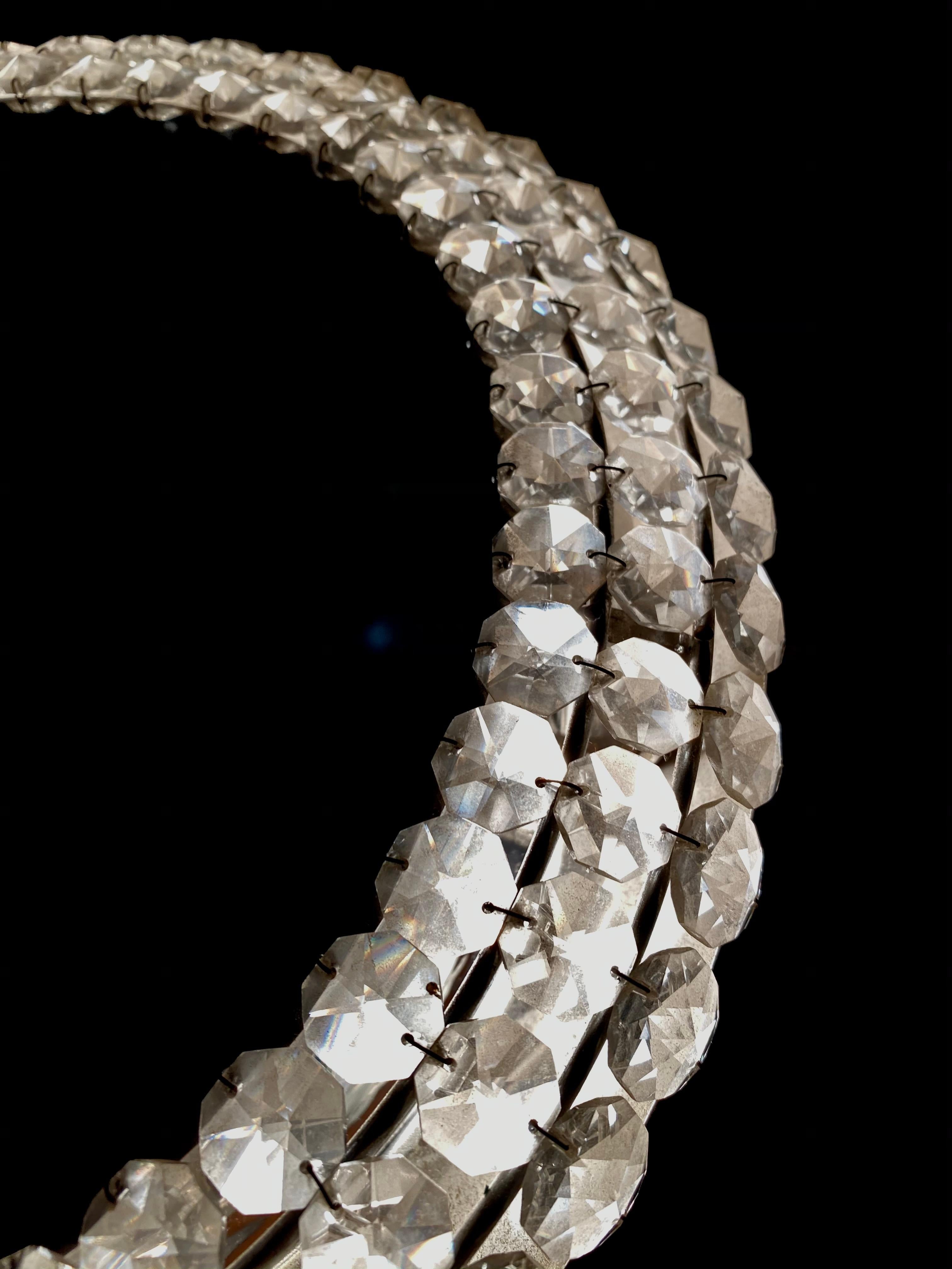 A wall mirror with indirect lighting from the German manufacturer Hillebrand Lighting. It was manufactured in the 1970s. The frame accommodates four E14 bulbs (max. 40W). The mirror frame and base are made of metal and decorated with crystals.
This