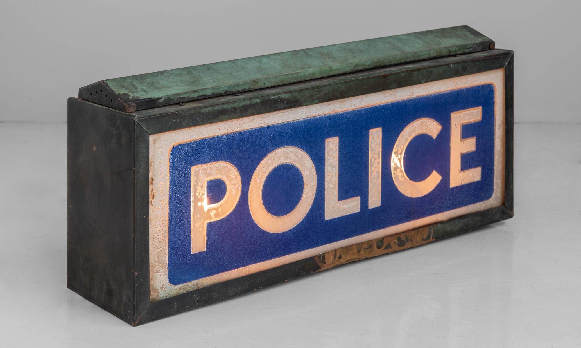Illuminated police sign, England, circa 1930.

Beautifully patinated sign with interior light.