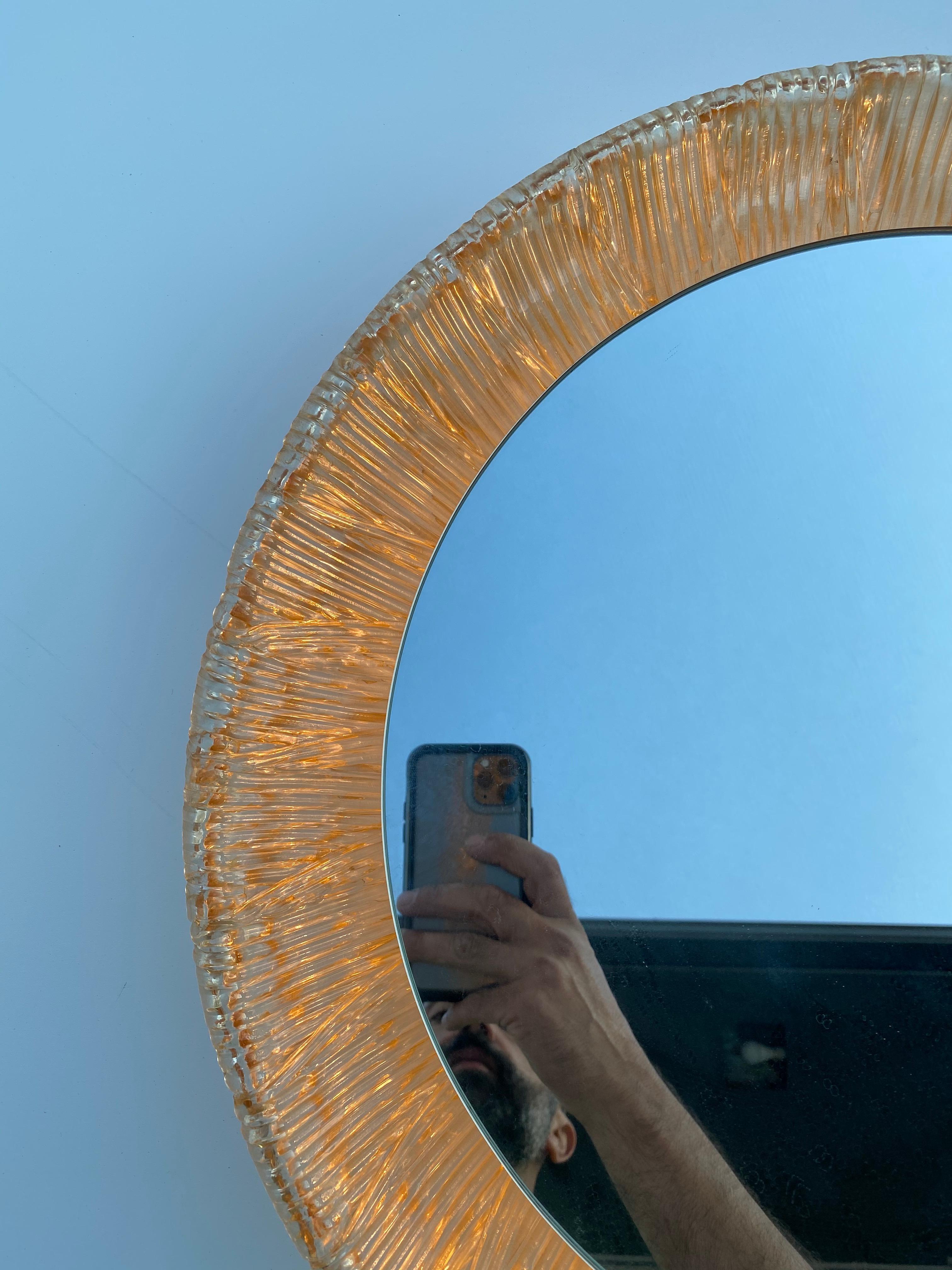 Backlit Illuminated round acrylic wall mirror. Requires four E14 base up to 40watt bulbs.