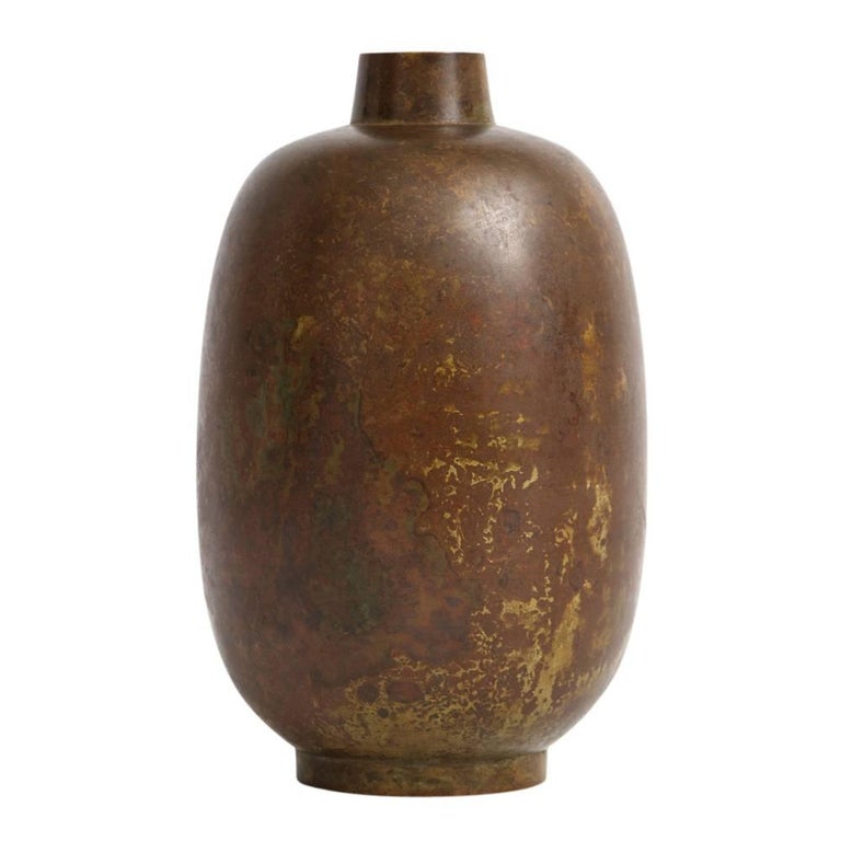 Illums Bolighus bronze vase. Small footed vase with rounded shoulders and warm patina. Retains two original labels on the underside. One which reads Illums Bolighus Center of Modern Design. The other label reads: Illums Bolighus E3 802 134-1.
