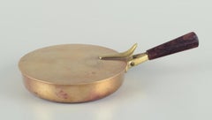 Illums Bolighus, lidded saucepan in brass. Wooden handle. Danish design.