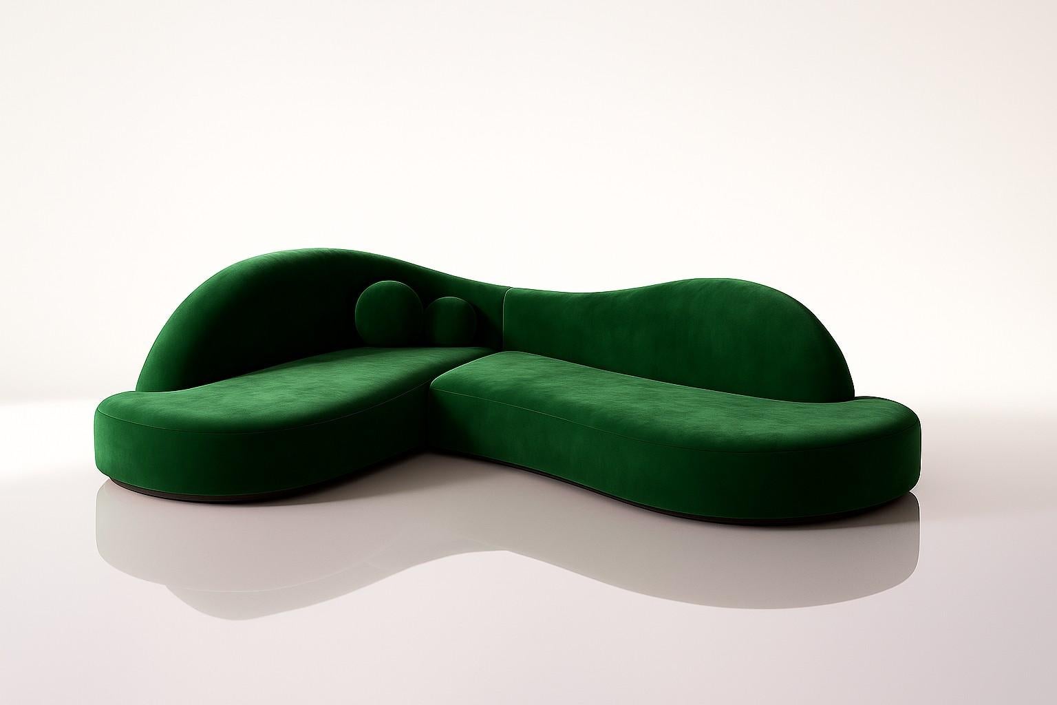 This sofa distinguishes itself with its curved silhouette and organic back design, creating the illusion of seamlessly fitting into a 90-degree corner and making any room feel cozy. Its timeless design, featuring a contemporary silhouette with soft