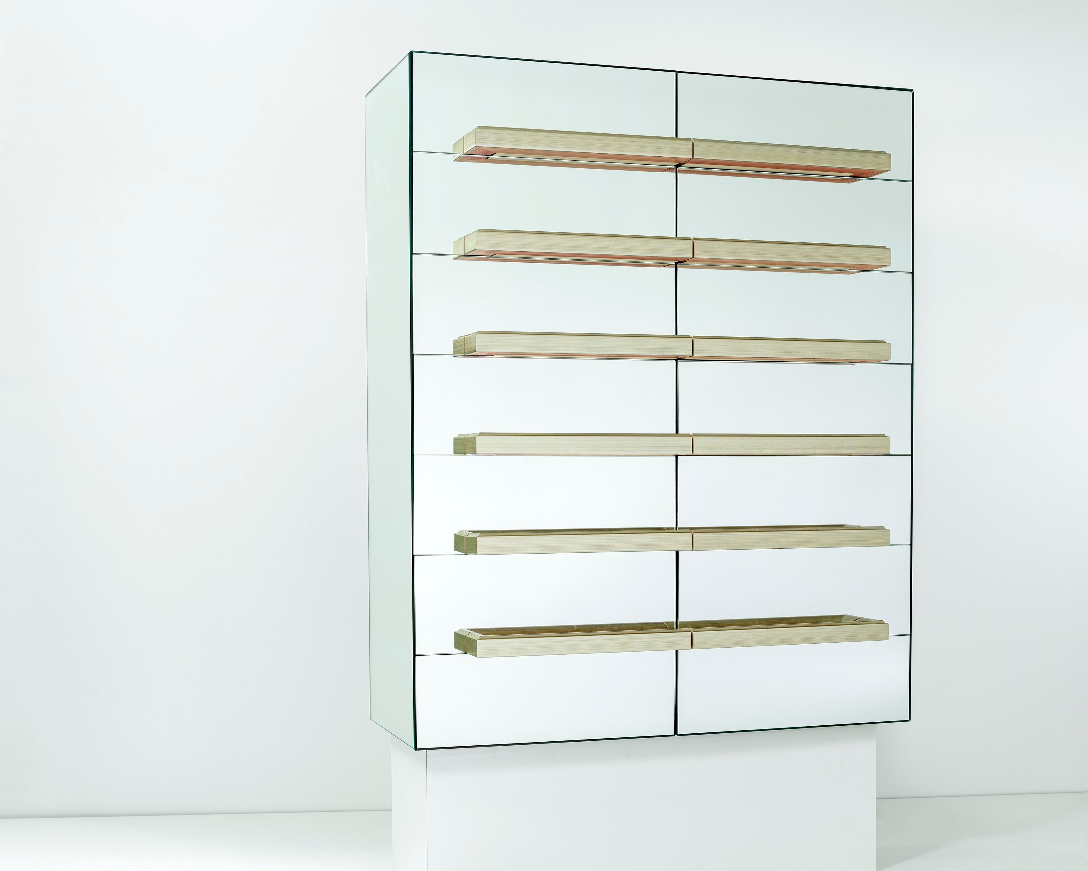 Illusion floating dry bar by Luis Pons.
Dimensions: W 101.5 x D 44 x H 124.5 cm
Materials: metal, mirror, wood, bronzed, hand-crafted, tempered.

Also available in different colors.

The traditional french mirror cabinet is reinterpreted