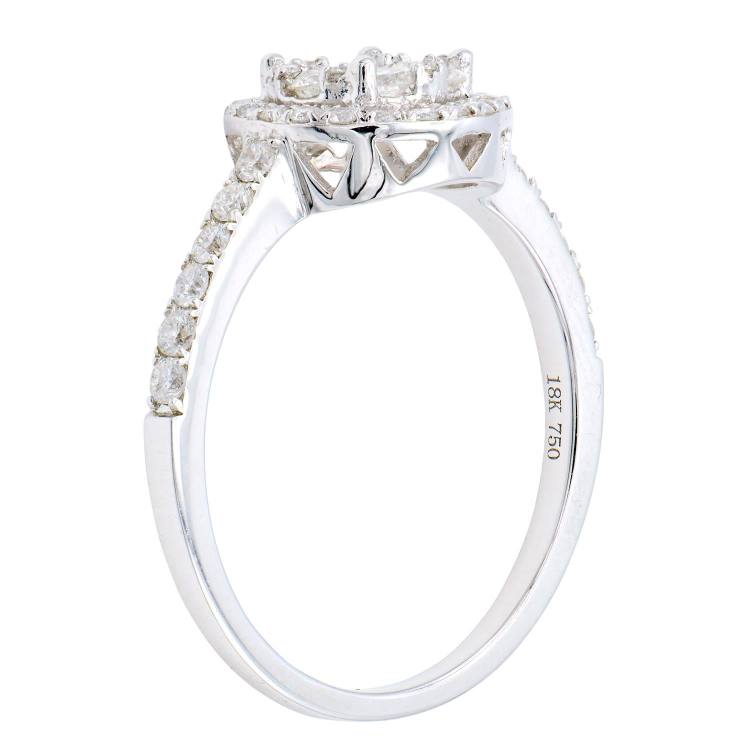 Illusion rings create a beautiful round diamond look without having to buy one big diamond. This ring is made of 45 round VS2, G color diamonds that are expertly assembled to create the look of one big round diamond. It is then finished with a