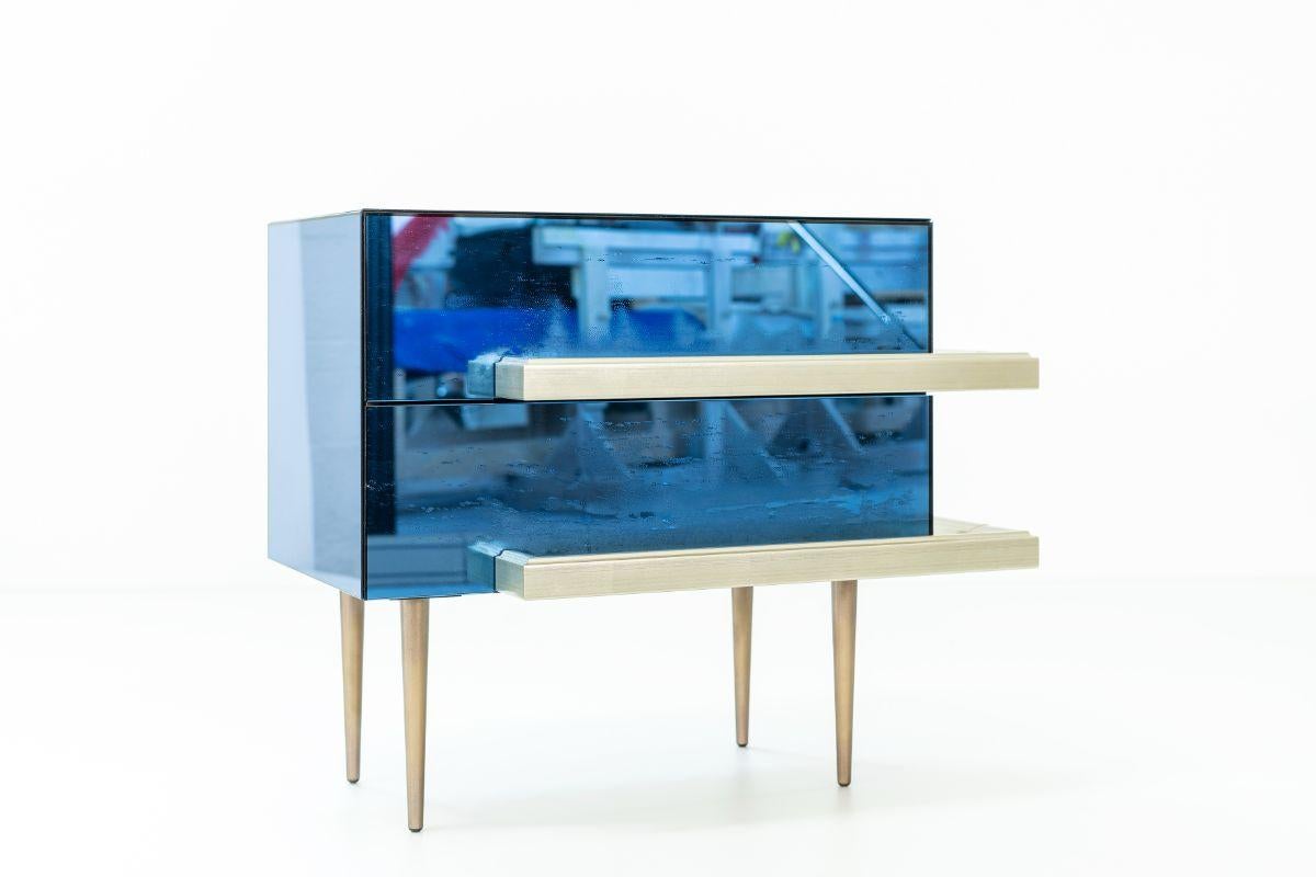 Illusion set of 2 nightstands water blue by Luis Pons.
Dimensions: W 68.5 x D 43 x H 58.5 cm.
Materials: Glass, metal, wood, bronzed, hand-crafted, tempered.

Also available in different colors.

The traditional french mirror cabinet is