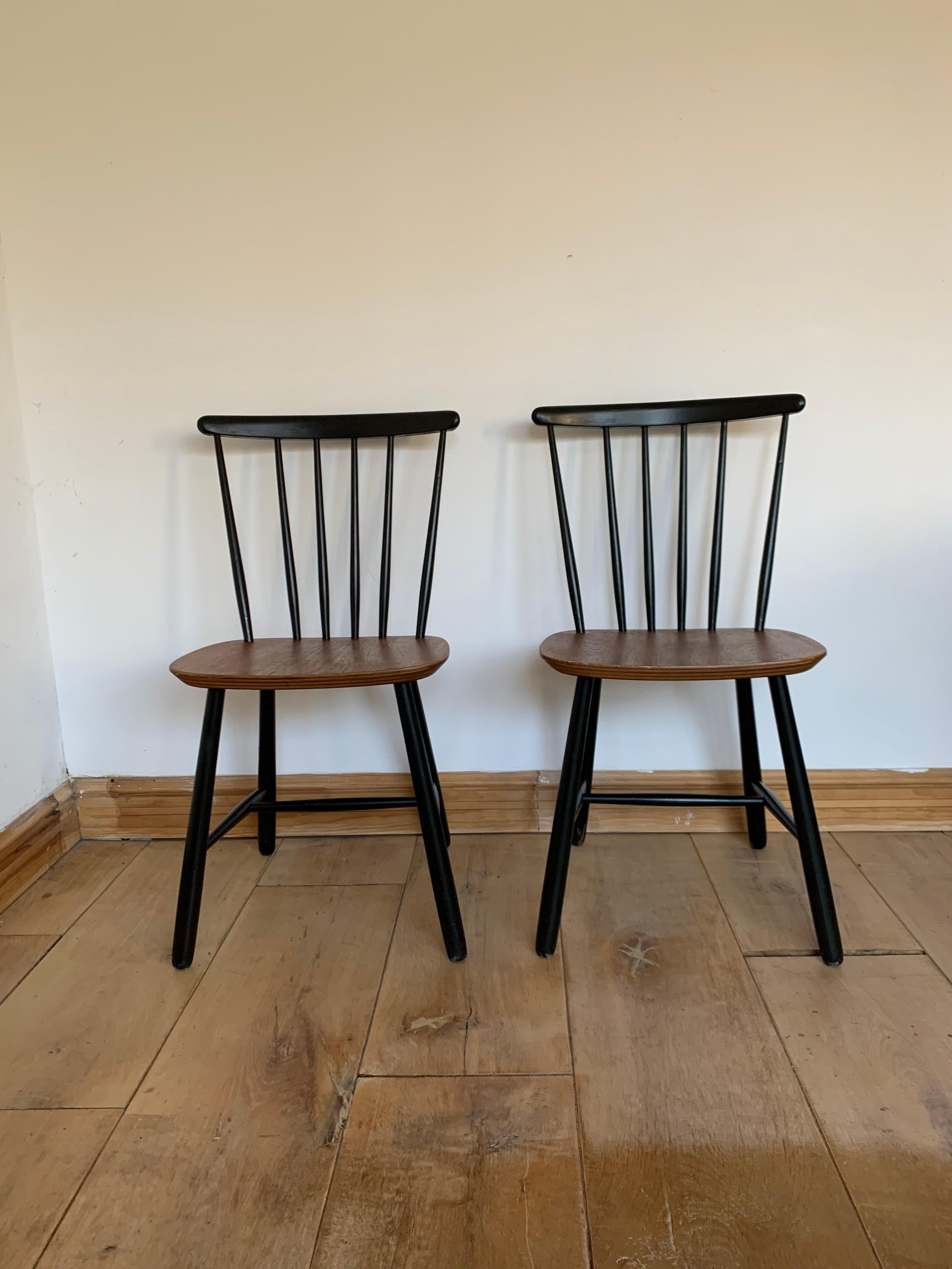 This is a set of 2 beautiful chairs featuring a spindle back and a teak ply seat. The set was made, circa 1960. There were several companies producing this type of chair in the midcentury: Edsby Verken, Pastoe and Nesto. Those chairs come from