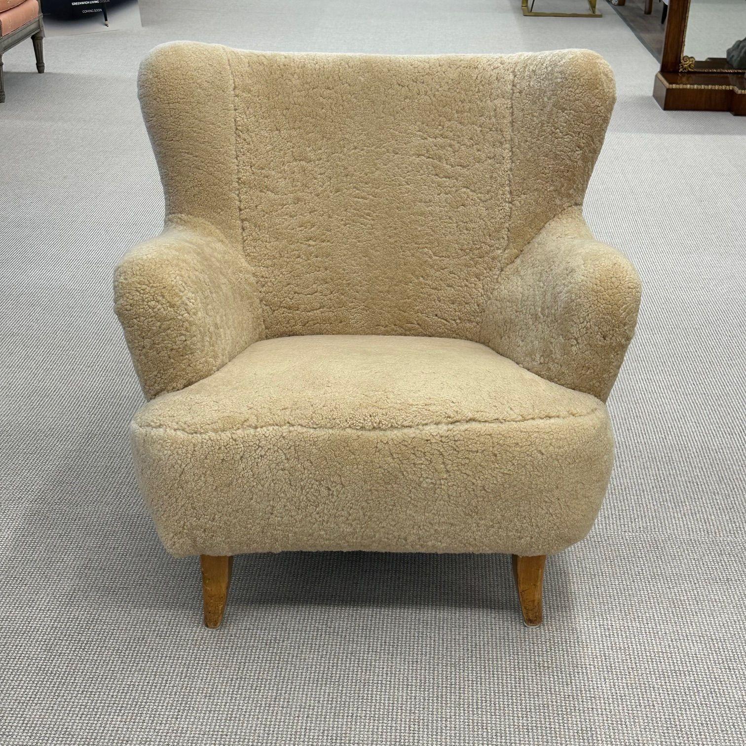 Ilmari Lappalainen, Asko, Finnish Mid-Century Modern, Lounge Chair, Shearling, Lacquered Wood

A 'Laila' armchair designed by Ilmari Lappalainen for Asko in Finland circa 1950s. The upper has been newly upholstered in a genuine honey sheepskin and