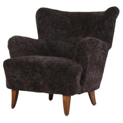Fauteuil 'Laila' d'Ilmari Lappalainen en peau de mouton expresso, années 1950