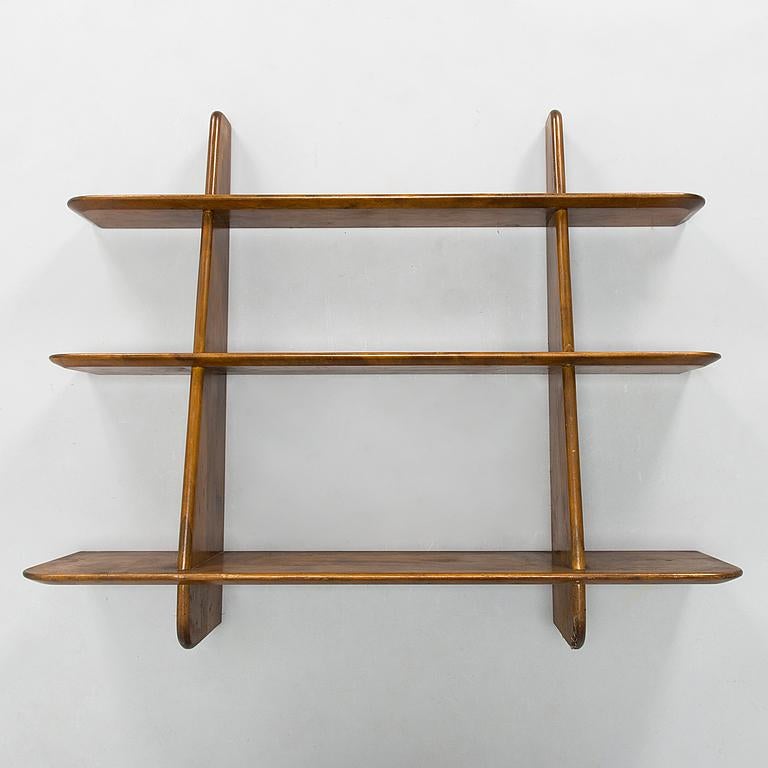Ilmari Lappalainen, a mid-20th century 'Leo' Book shelf/wall shelf for Asko.

Stained and lacquered birch. Measures: Width 105 cm. Height 87 cm.